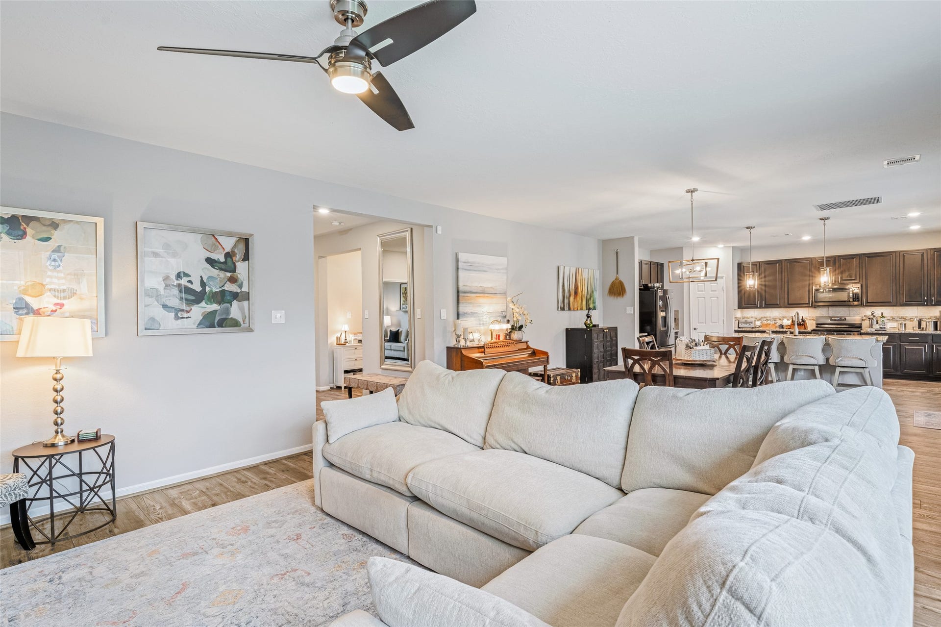 3806 Belmore Lane, Pearland, TX 77584 Everyday living feels connected in your open-concept main level, where the living room flows easily into the dining area and kitchen for effortless time together.