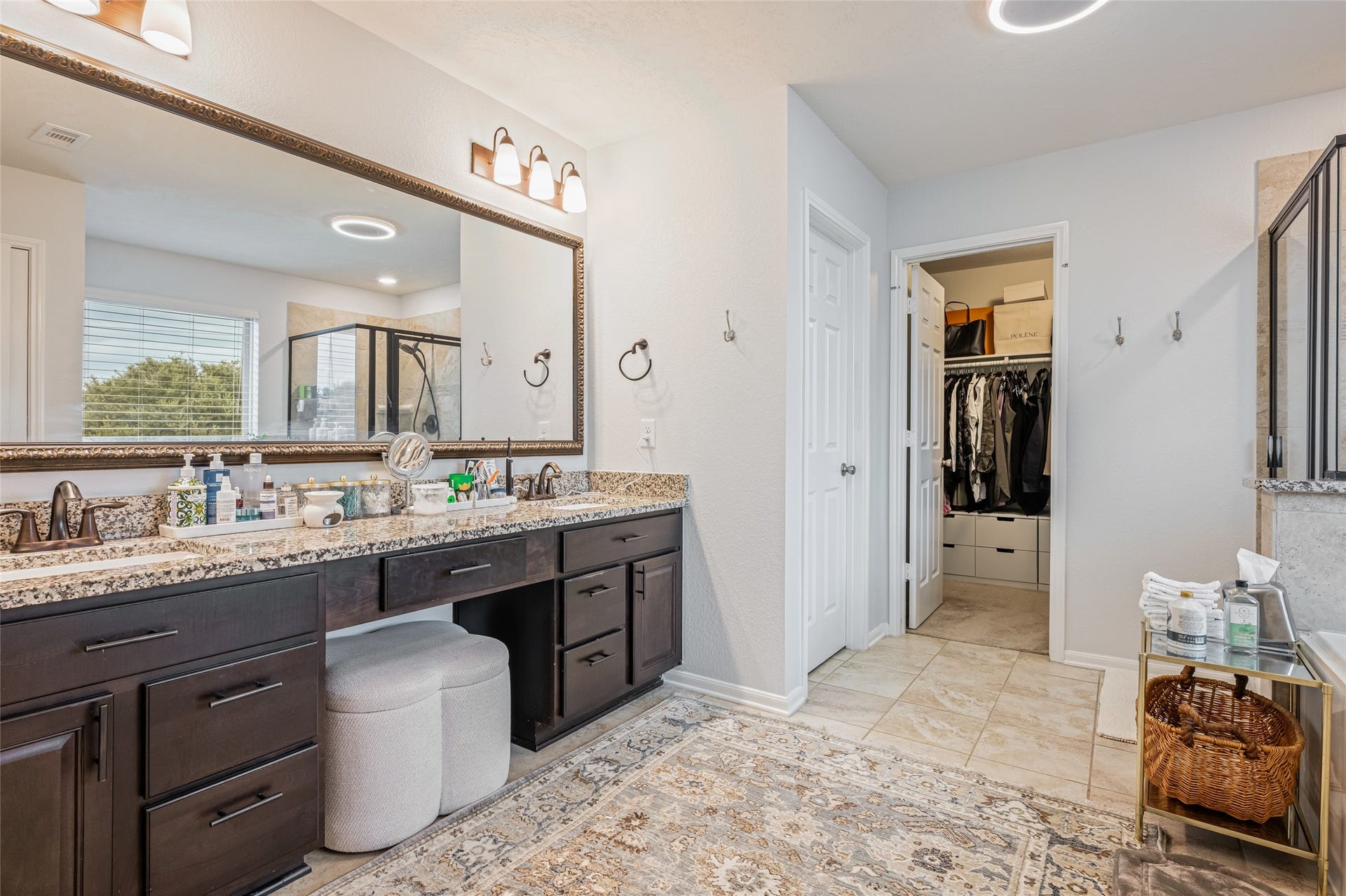 3806 Belmore Lane, Pearland, TX 77584 Getting ready is easy in your spacious primary bath, complete with a long dual-sink vanity, granite counters, abundant storage, and direct access to the walk-in closet.