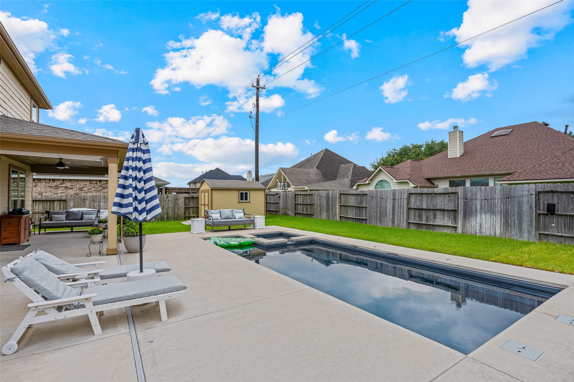 3806 Belmore Lane, Pearland, TX 77584 Weekends at home feel like a getaway with your private pool and spa, spacious patio, covered seating area, and fenced backyard.