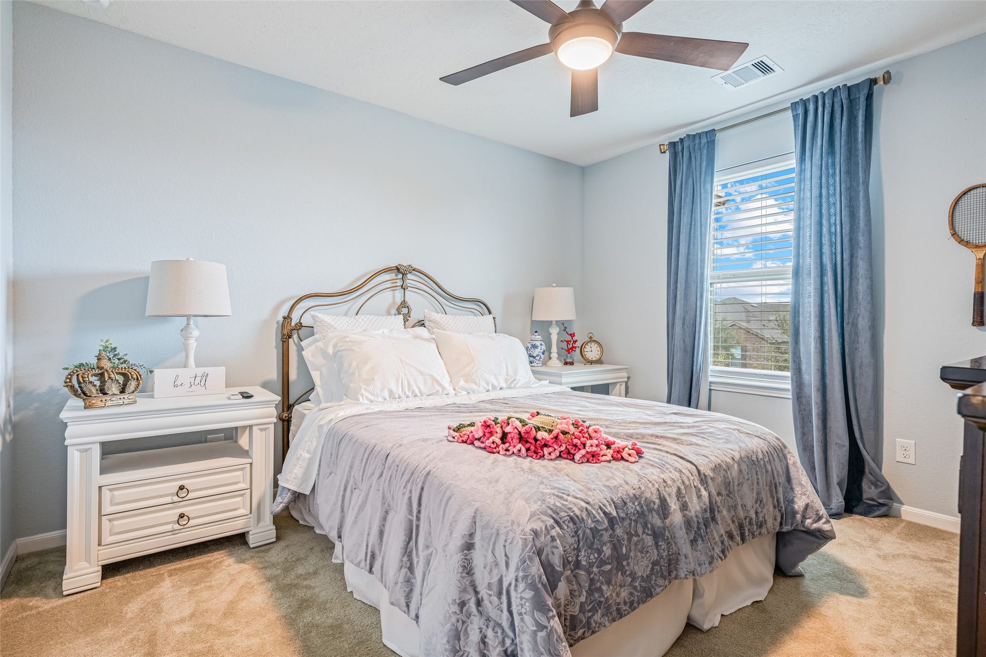 3806 Belmore Lane, Pearland, TX 77584 Settle into a comfortable secondary bedroom where soft carpeting, a ceiling fan, and natural light create an inviting place to recharge.