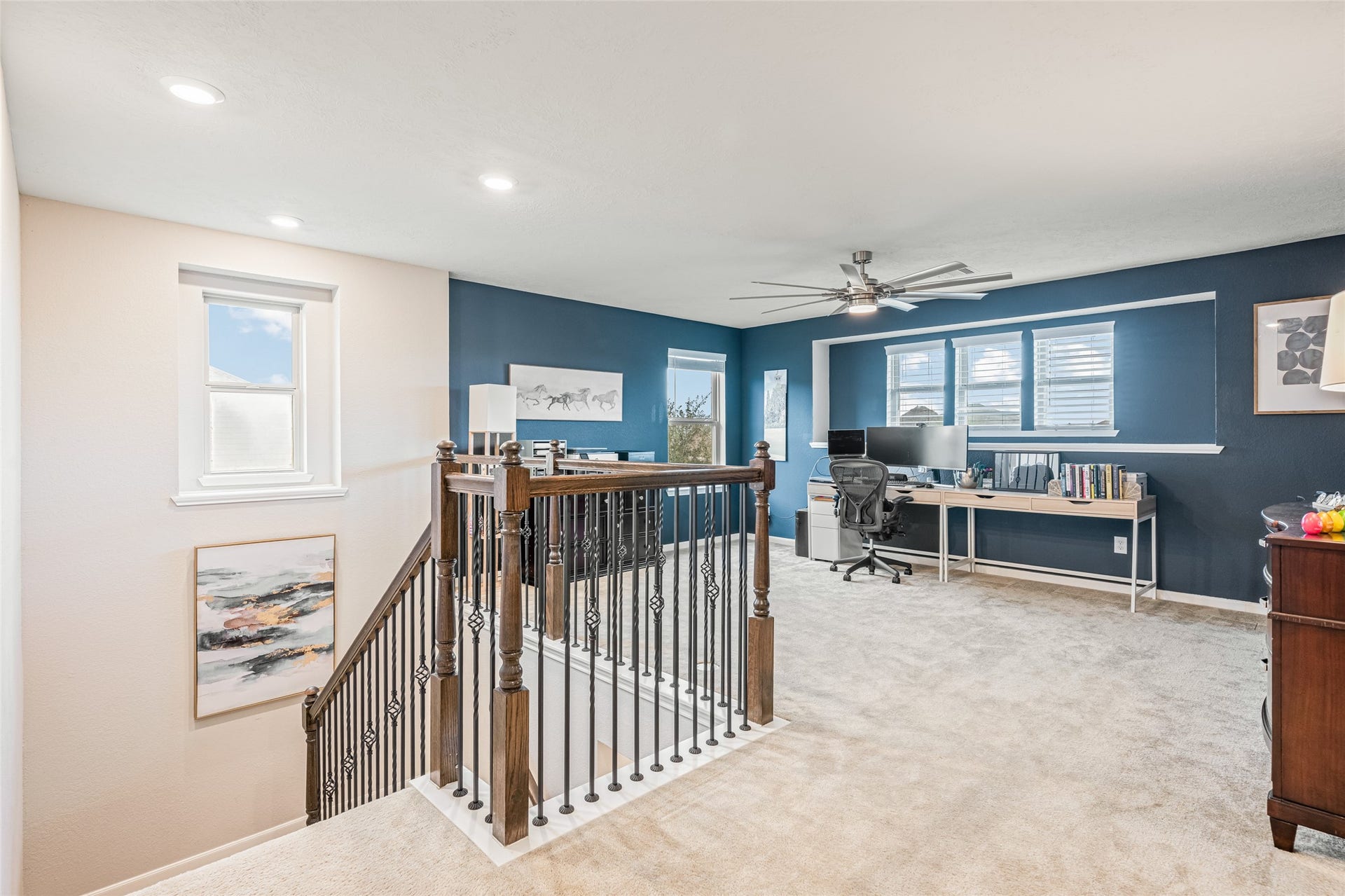 3806 Belmore Lane, Pearland, TX 77584 Working from home feels comfortable in your spacious upstairs loft, with abundant natural light, plenty of room for a full desk setup, and open views over the stairway.