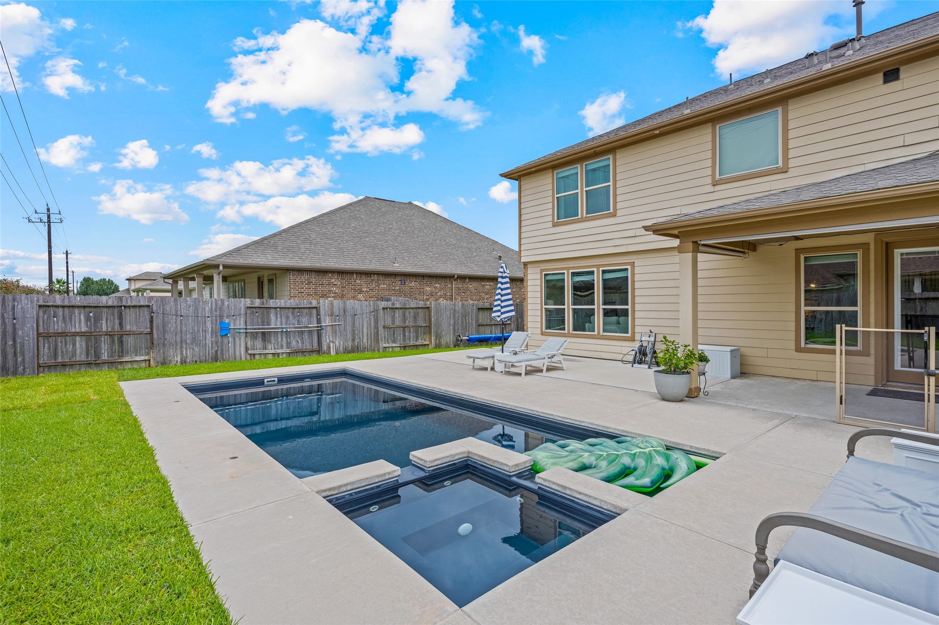 3806 Belmore Lane, Pearland, TX 77584 Spend sunny afternoons in your own backyard retreat, complete with a sparkling pool, spa, and plenty of surrounding patio space for lounging.