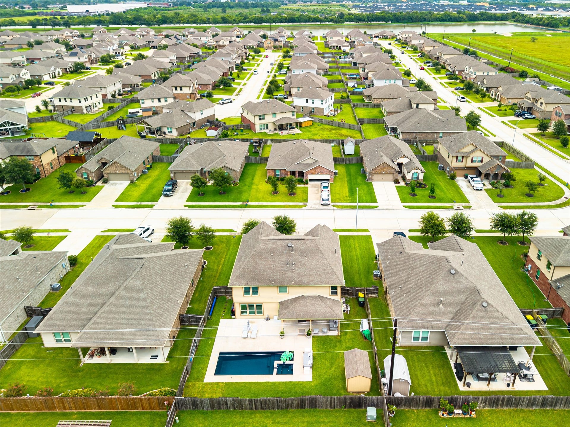 3806 Belmore Lane, Pearland, TX 77584 From above, the neighborhood setting surrounds your home while the backyard pool stands out as your own private escape.