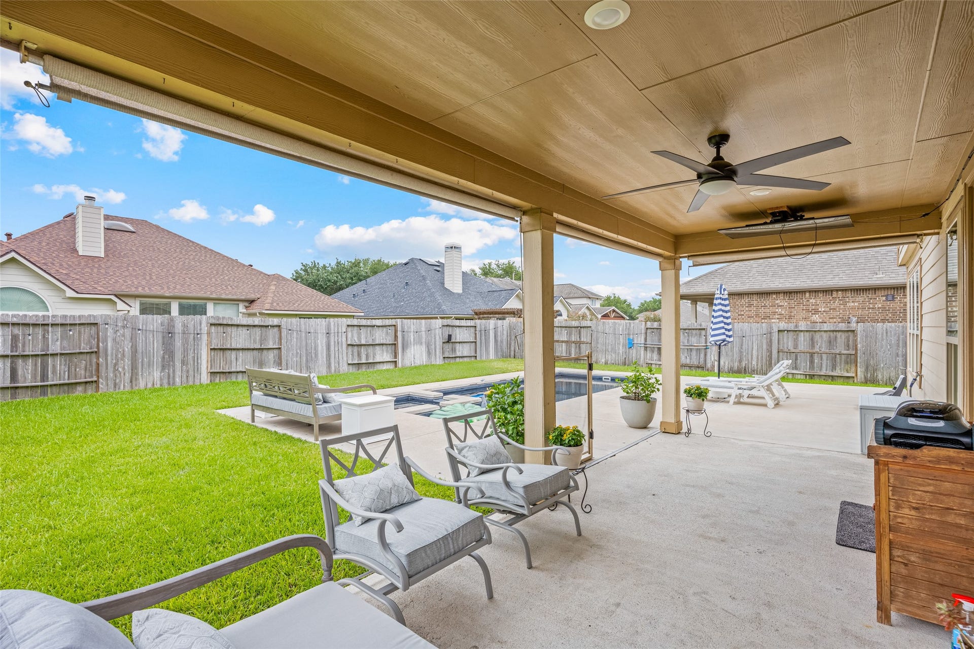 3806 Belmore Lane, Pearland, TX 77584 Weekends unfold right outside your back door, with a covered patio overlooking the pool, spa, and fenced backyard for effortless lounging and entertaining.