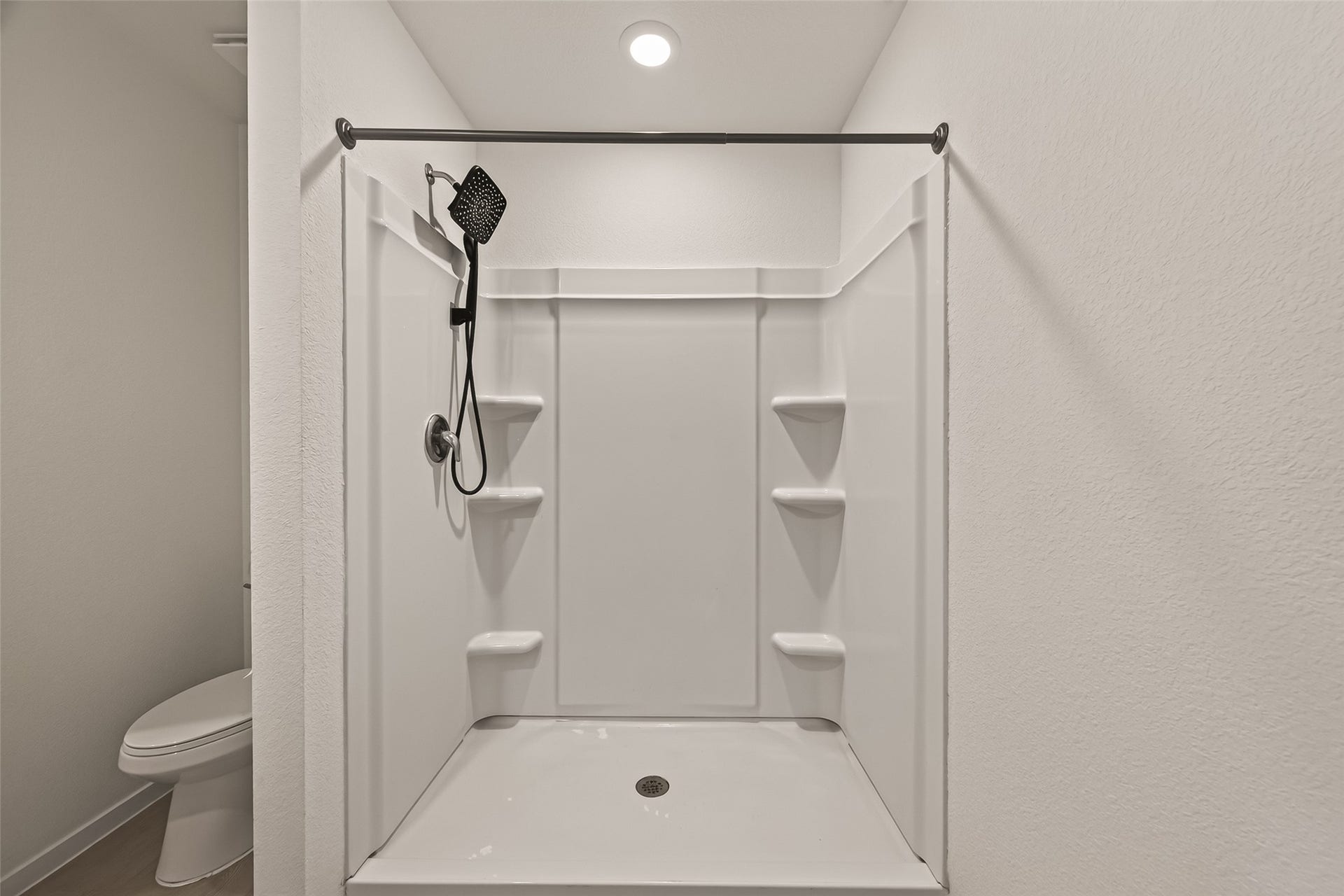 7814 Lavender Jade Drive, Rosharon, TX 77583 This view of the shower highlights the spacious interior and the installed rainfall showerhead.