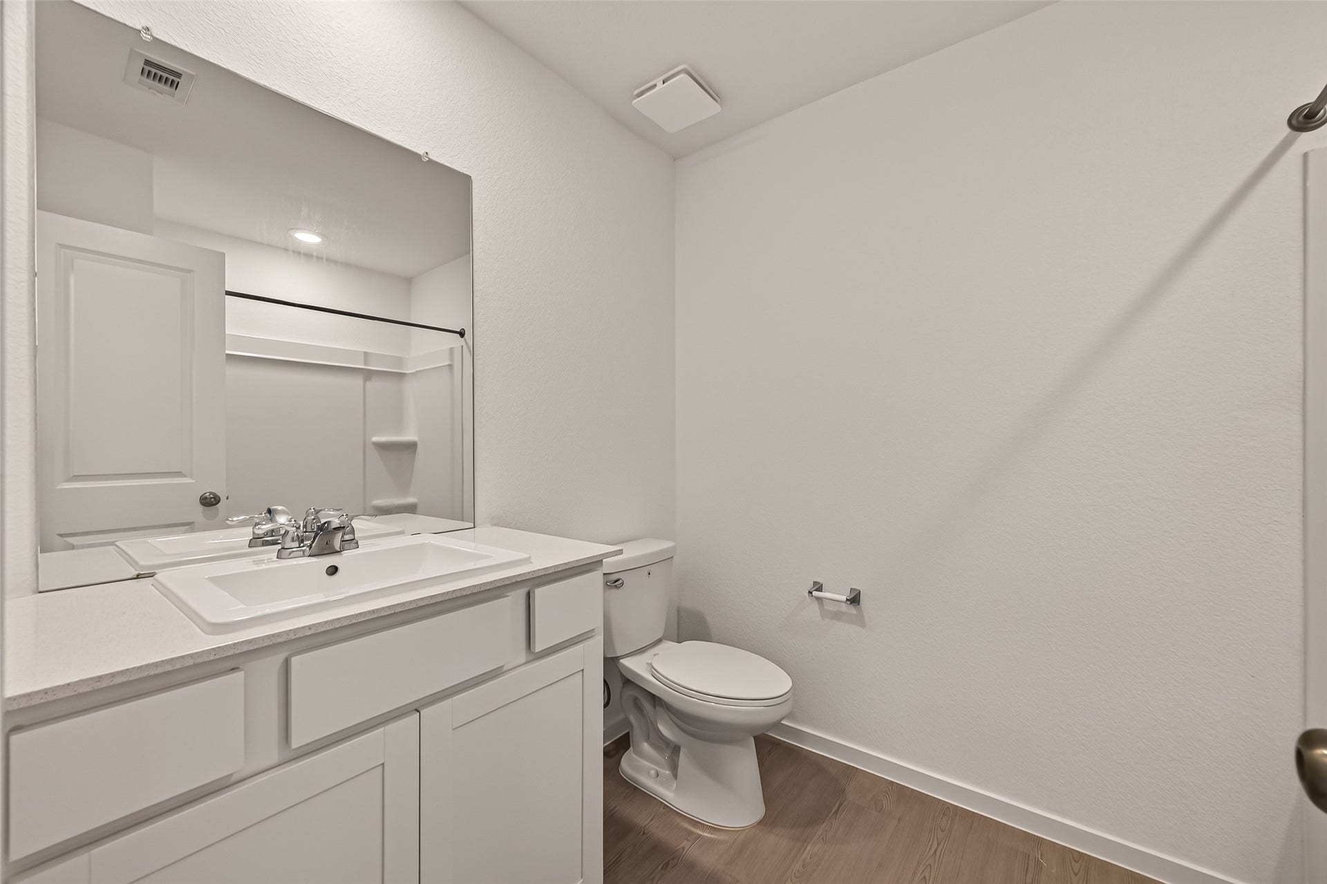 7814 Lavender Jade Drive, Rosharon, TX 77583 Full bathroom featuring a shower-tub combination, durable Corian countertops, a large vanity mirror, and ample storage space for all your essentials.