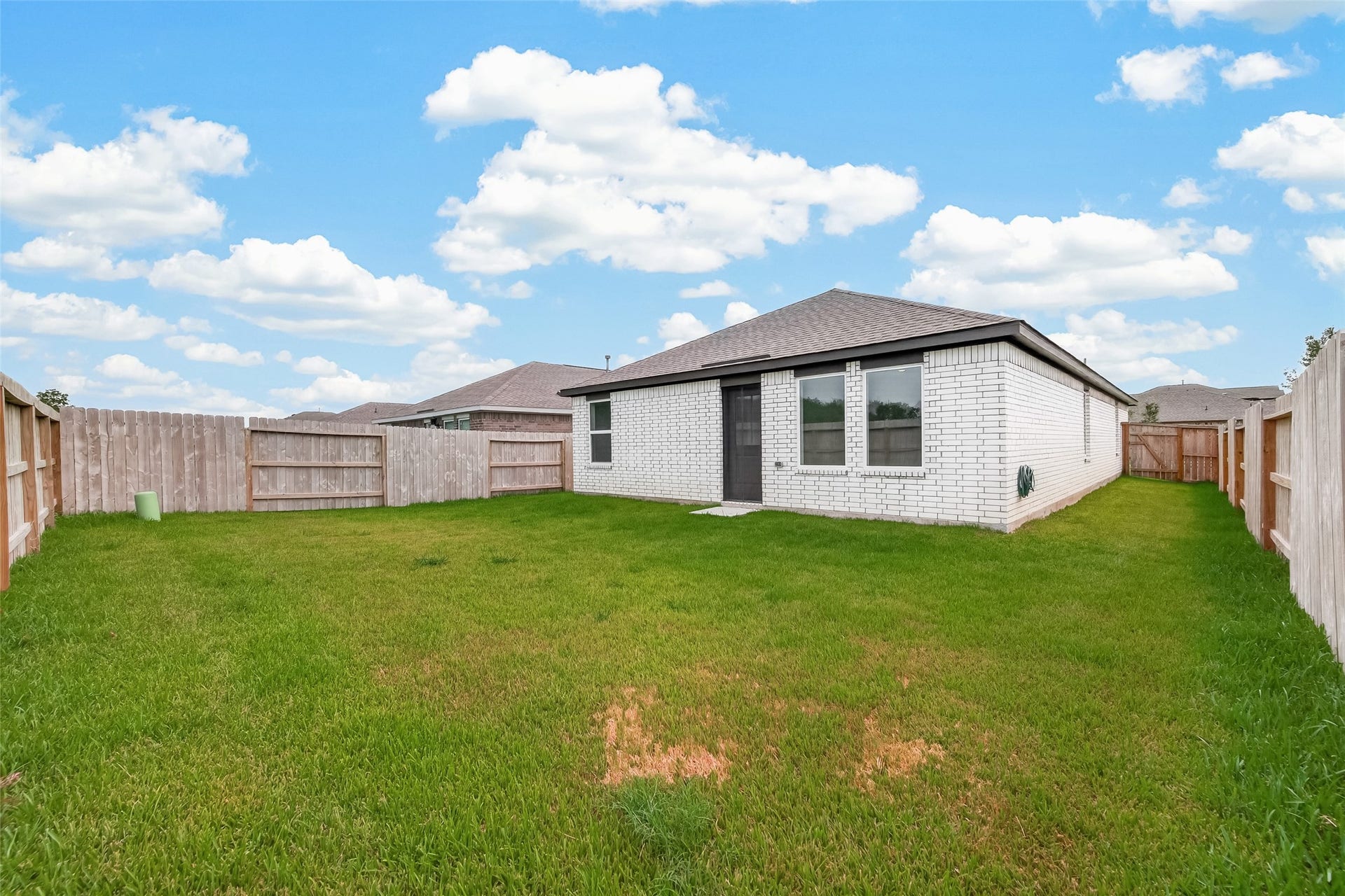 7814 Lavender Jade Drive, Rosharon, TX 77583 This view showcases the expansive back and side yard, providing an ideal setting to create your own private oasis.