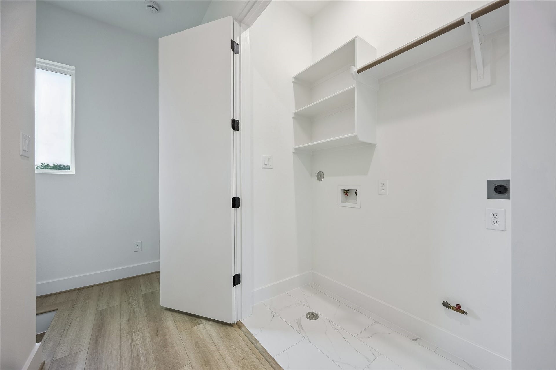 The centrally located utility room is conveniently situated between the bedrooms and is equipped for either a gas or electric dryer.