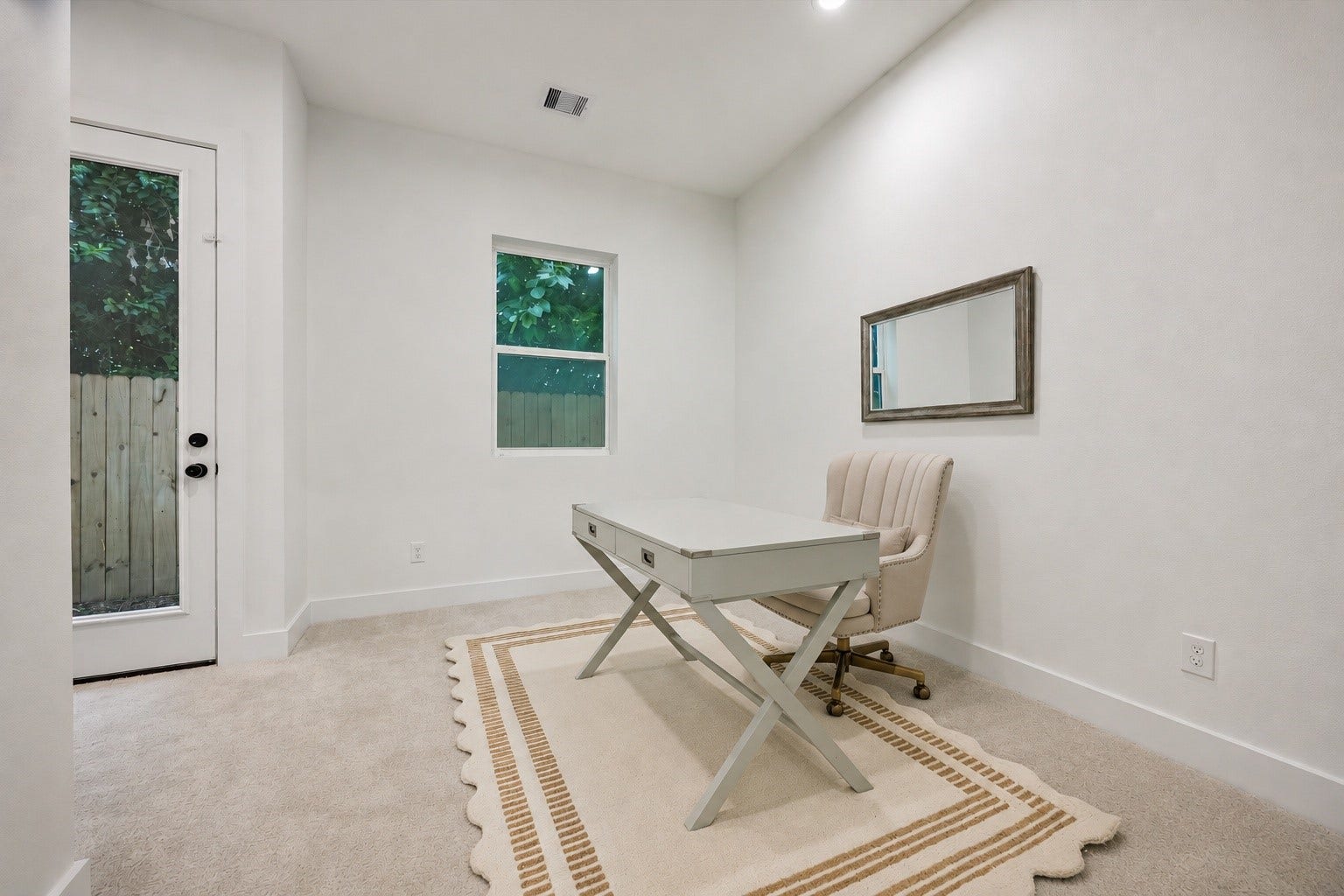 Versatile and inviting, the first-floor bedroom is equally suited as a guest suite or home office, with direct access to the backyard. We'll explore the outdoor space shortly.