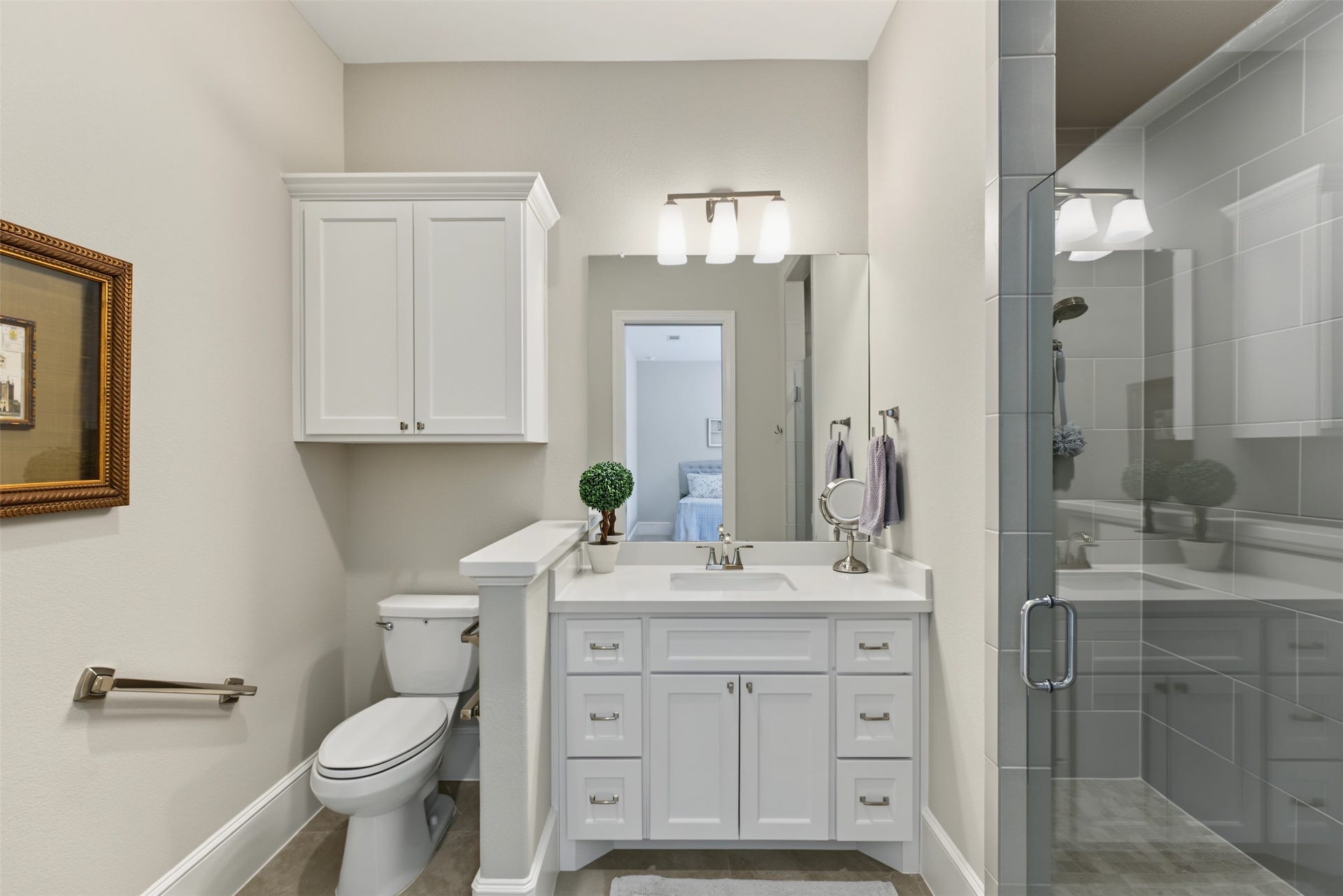 501 Corsair Court, Montgomery, TX 77316 Over-sized bathroom with roll-in shower and pocket door from the bedroom.