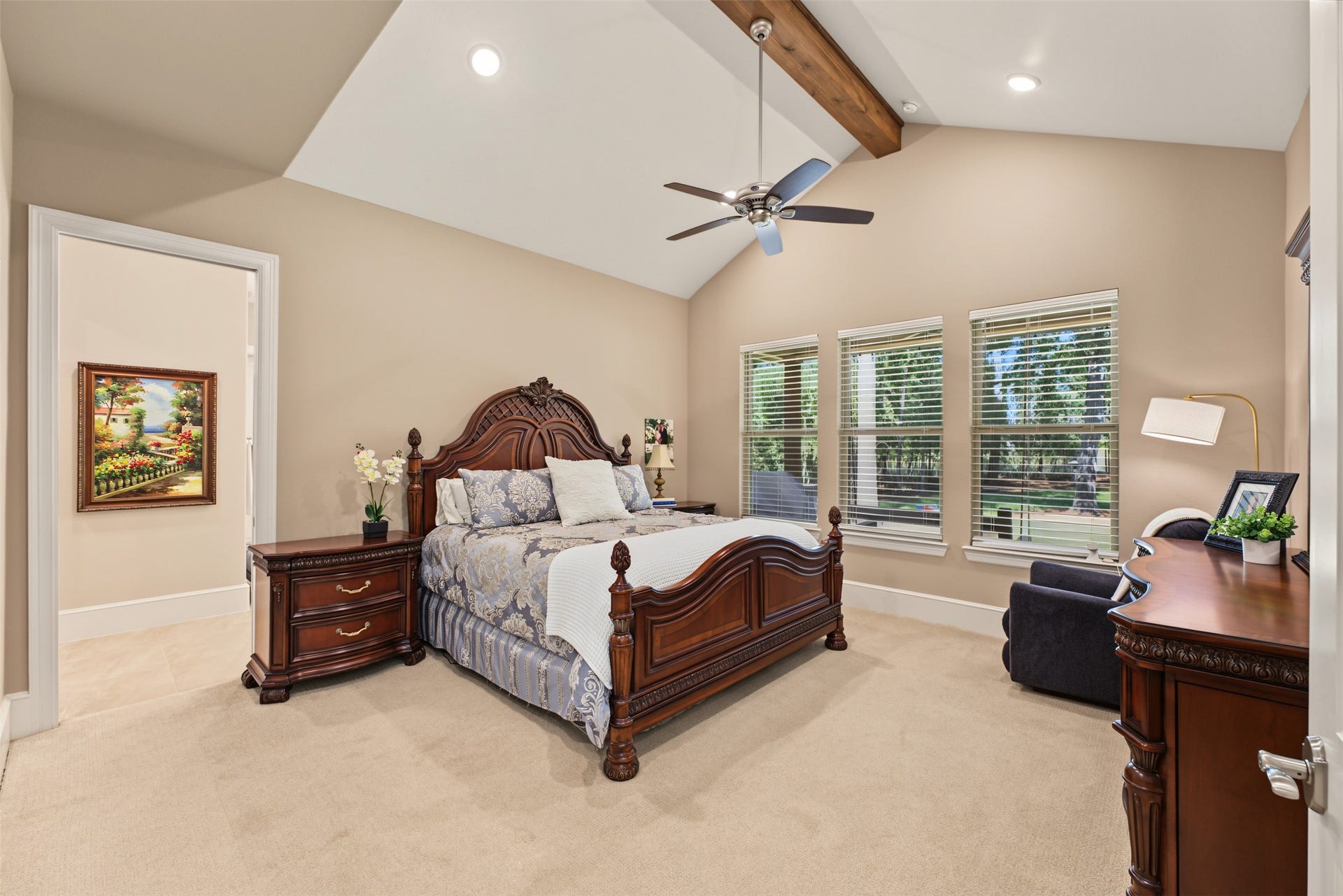 501 Corsair Court, Montgomery, TX 77316 Just past the kitchen is the primary suite with cedar wrapped beam and views of the back yard.