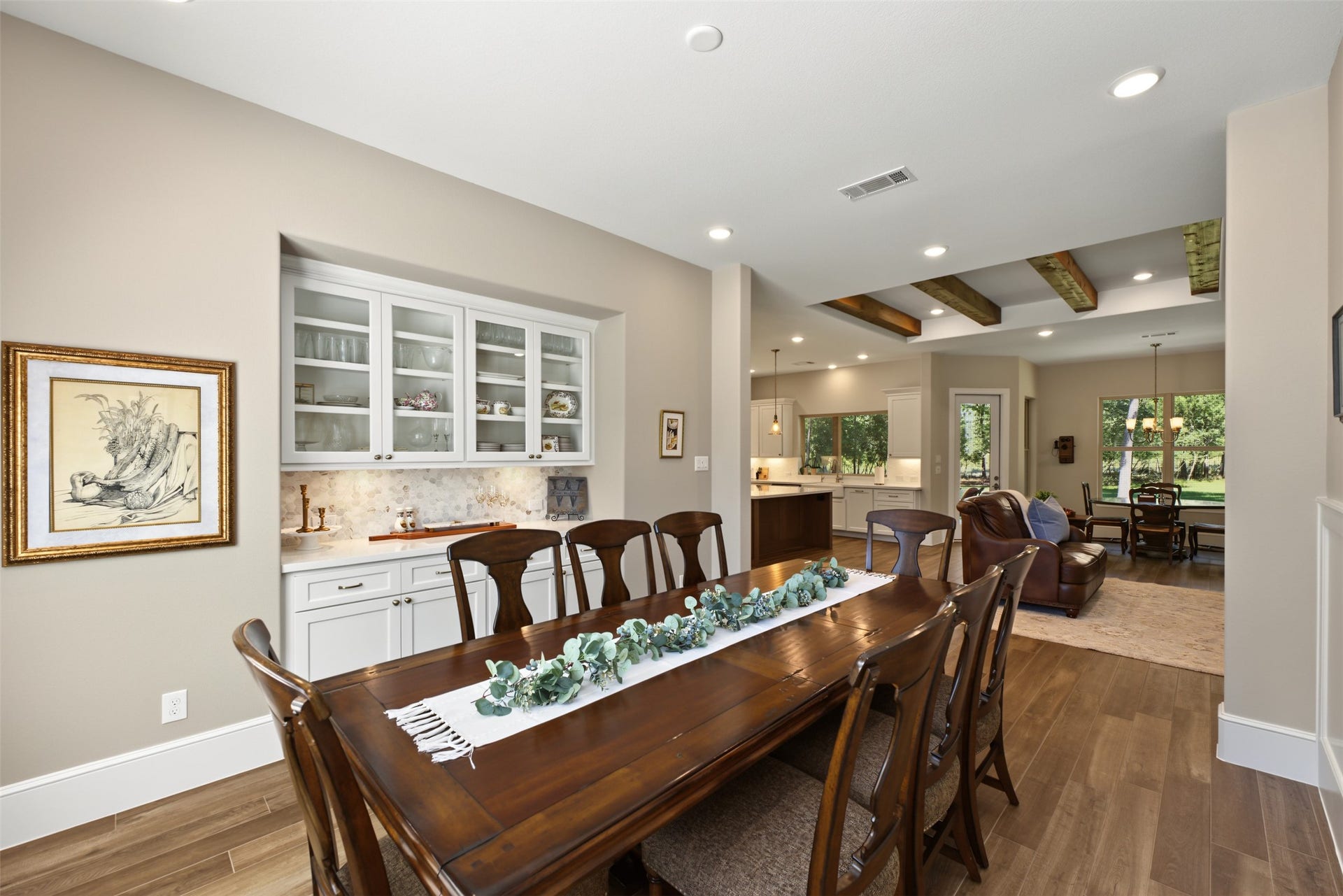 501 Corsair Court, Montgomery, TX 77316 Dining room with built-ins and paneling for larger gatherings is adjacent to the kitchen and keeping room.