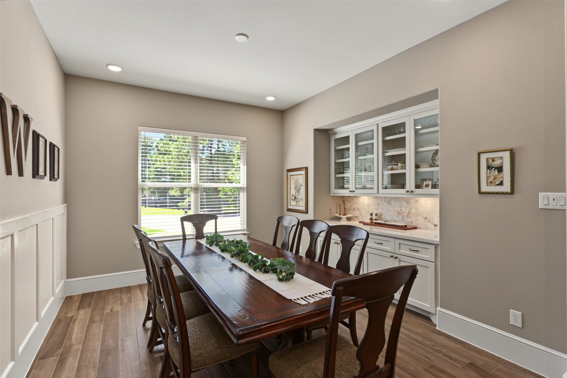 501 Corsair Court, Montgomery, TX 77316 Dining room with built-ins and paneling for larger gatherings is adjacent to the kitchen and keeping room.