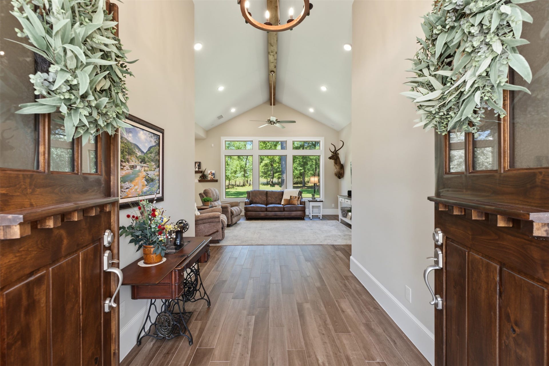 501 Corsair Court, Montgomery, TX 77316 Double doors welcome you to the warmth of cedar wrapped beams and a view of the private yard with space to grow and add on to the sanctuary.