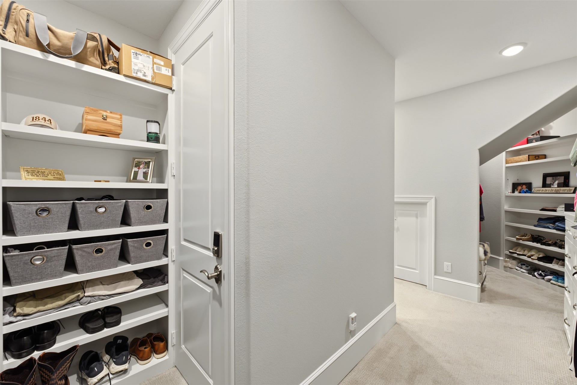 501 Corsair Court, Montgomery, TX 77316 Walk-in primary closet has built-in dresser and custom shelving with bench seat. Also in the primary closet is access to the safe room.