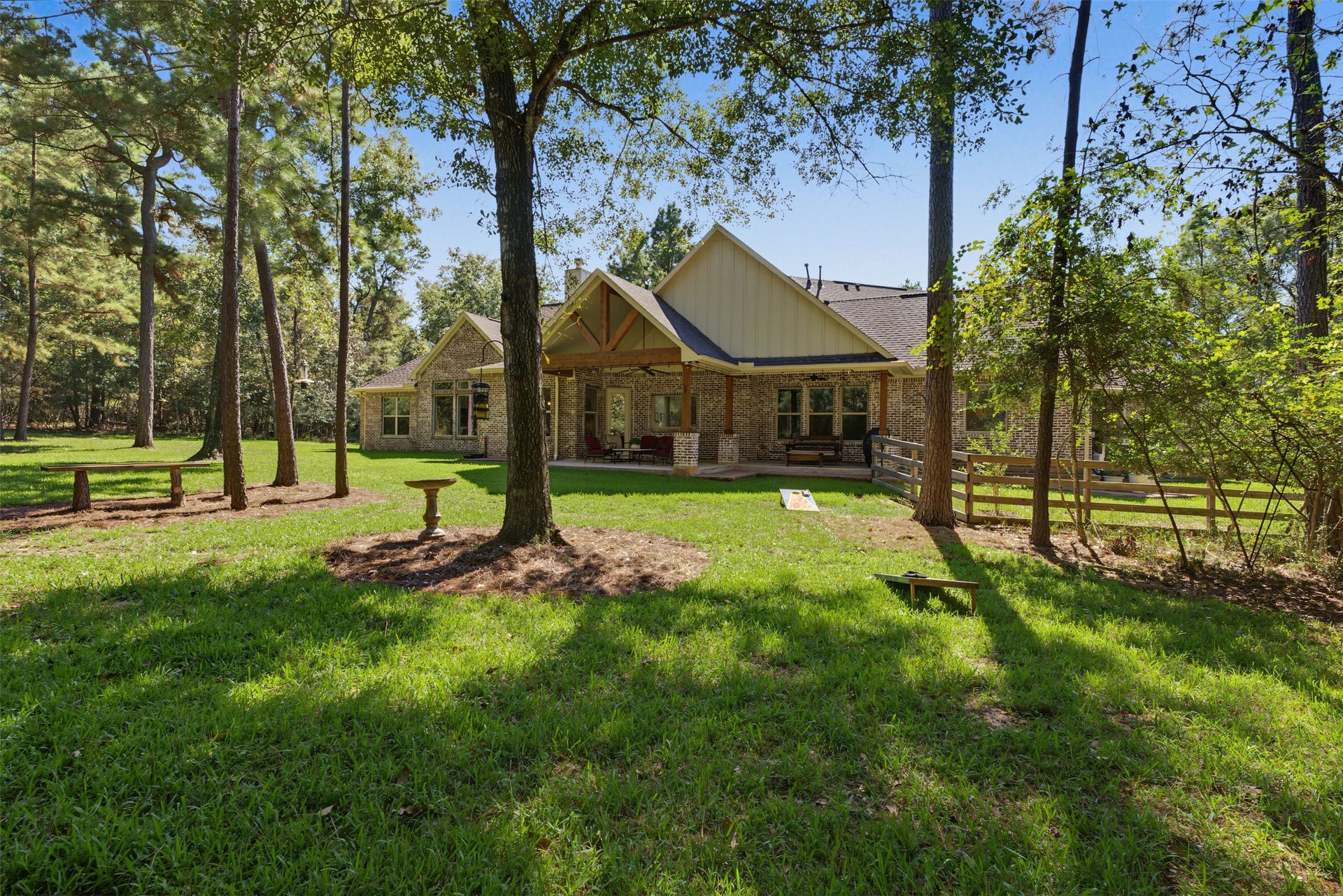 501 Corsair Court, Montgomery, TX 77316 From the side of the home behind the garage, the area is fenced for pets and or other hobbies.