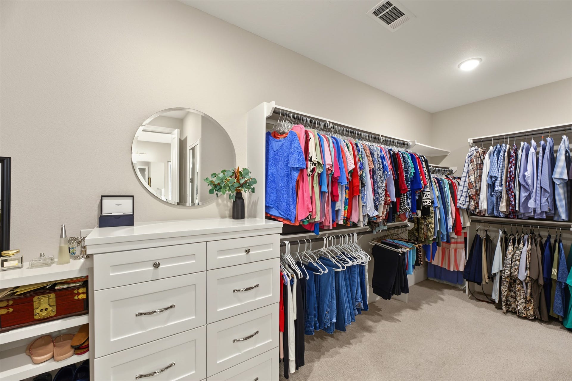 501 Corsair Court, Montgomery, TX 77316 Walk-in primary closet has built-in dresser and custom shelving with bench seat. Also in the primary closet is access to the safe room.