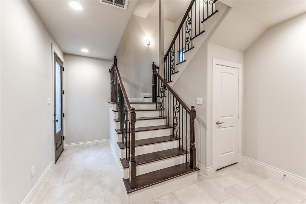 Beautiful wrought iron staircase with wooden steps