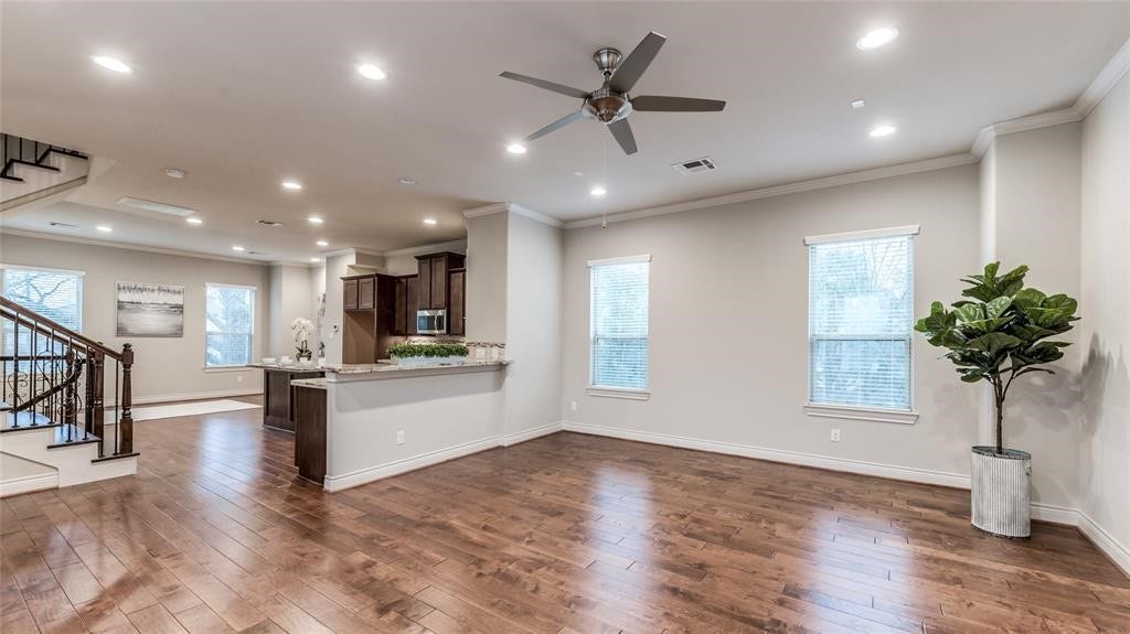 Large open plan living space, with half bath, crown moldings through out the second floor.