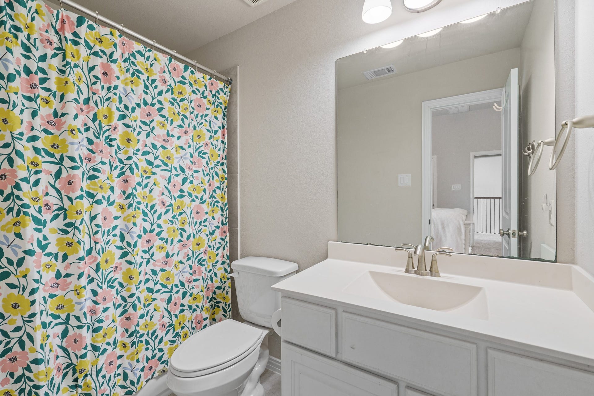 A private secondary bathroom is attached to one of the upstairs bedrooms.