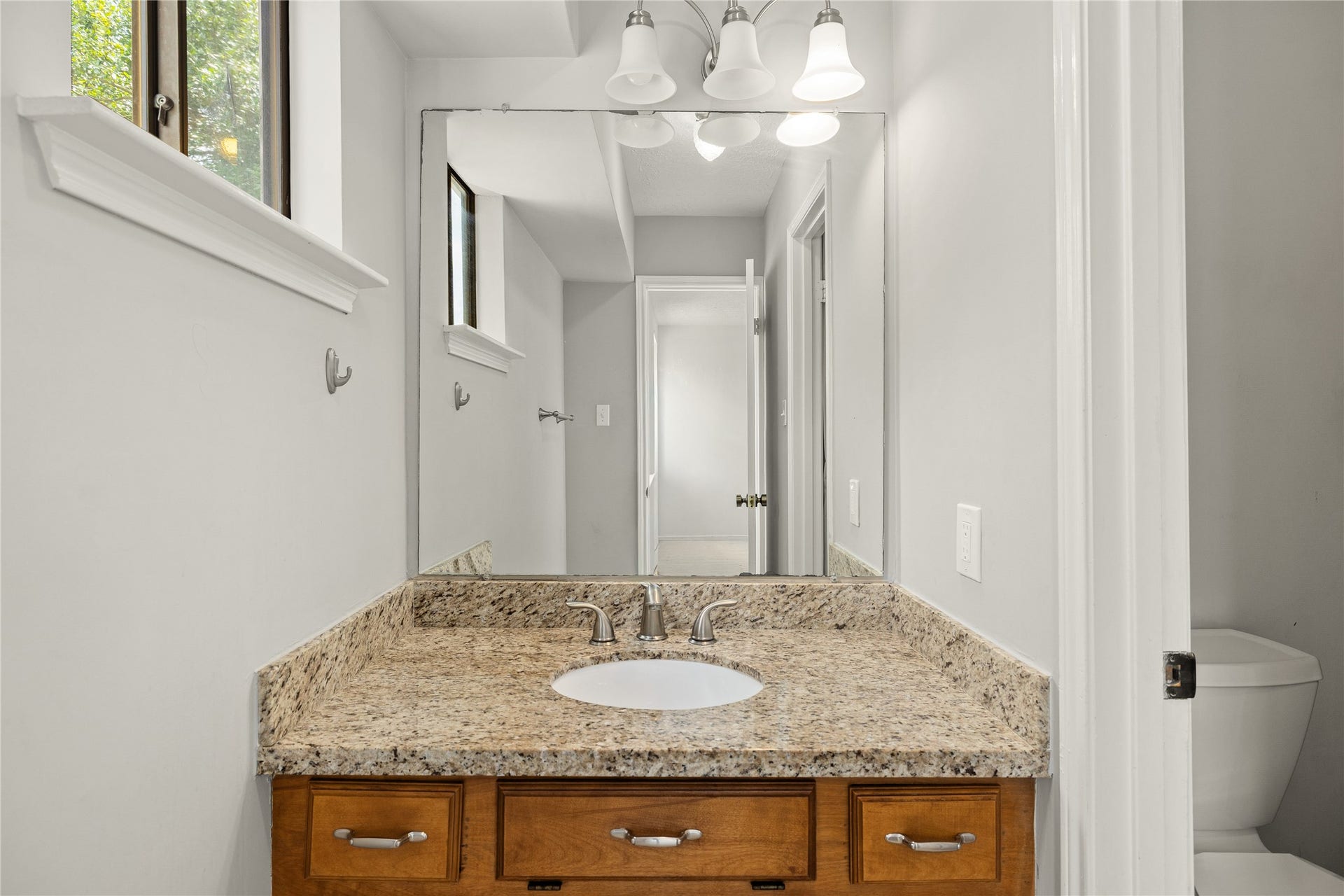 8007 Suspiro Drive, Houston, TX 77083 Secondary bedroom private vanity and access to shared bathroom.