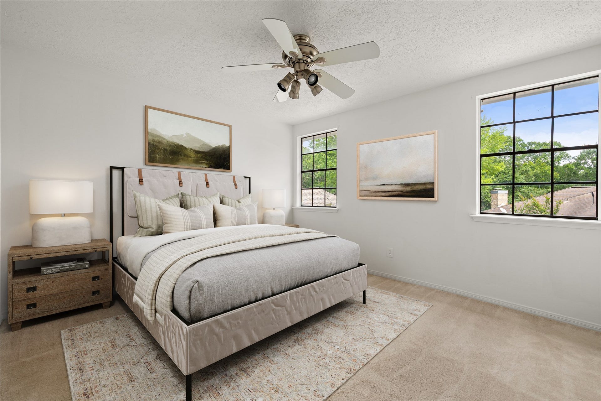 8007 Suspiro Drive, Houston, TX 77083 This serene and inviting secondary bedroom offers a perfect retreat for family or guests. The space is anchored by large windows that provides a view of the outdoors while filling the room with natural light. Soft, neutral wall tones and a ceiling fan with integrated lighting creates a comfortable environment year-round. Secondary bedroom has a private vanity and access to a shared secondary bedroom. *Virtually Staged