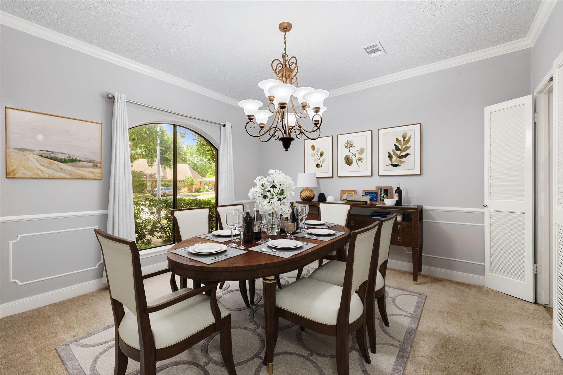 8007 Suspiro Drive, Houston, TX 77083 You and your guests will certainly dine in style in this amazing formal dining room, located in the front of the home! Featuring a gorgeous chandelier, large arched window, neutral paint, high ceilings, crown molding, chair rail and plush carpet flooring! Perfect space to entertain family and friends! *Virtually Staged