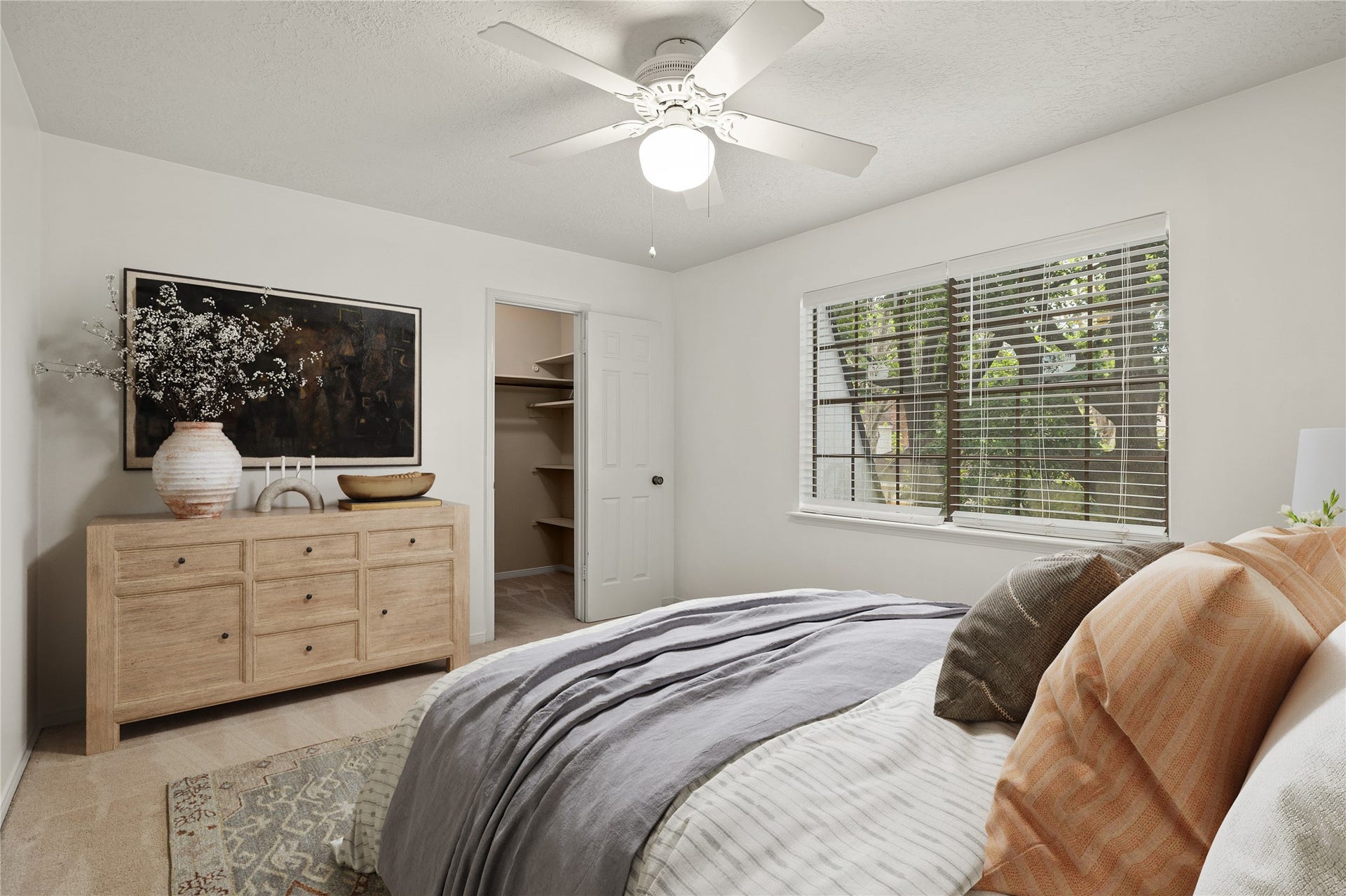 8007 Suspiro Drive, Houston, TX 77083 This bright and versatile secondary bedroom offers a comfortable retreat with a clean, modern aesthetic. The room is bathed in natural light from the large windows, creating an inviting space that can easily serve as a guest suite or childs room. *Virtually Staged