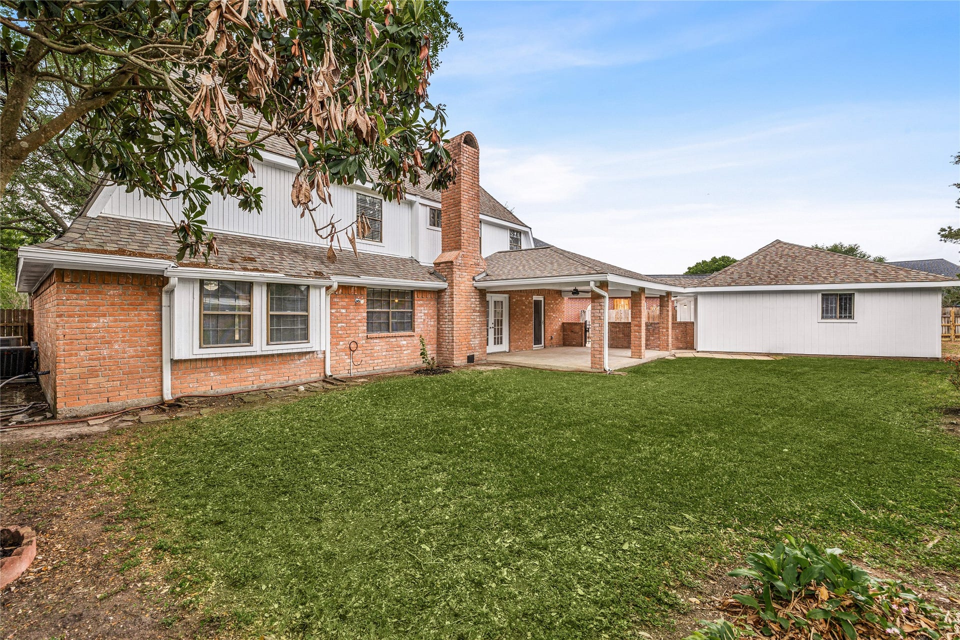 8007 Suspiro Drive, Houston, TX 77083 Enjoy your own private slice of nature with the mature landscaping.
