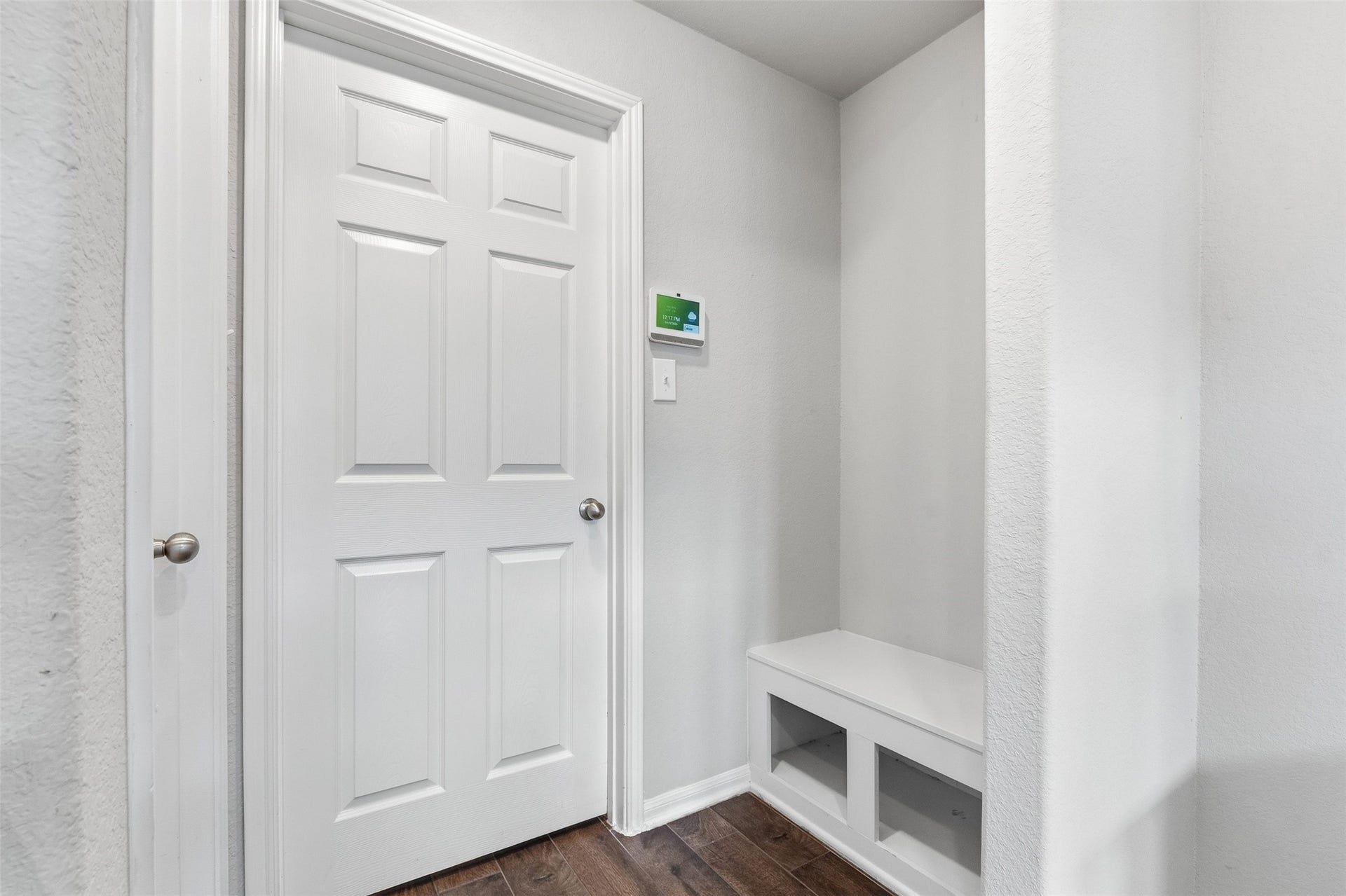 This laundry room and mudroom entry, conveniently accessible from the garage, provides a dedicated, organized space for all your belongings.