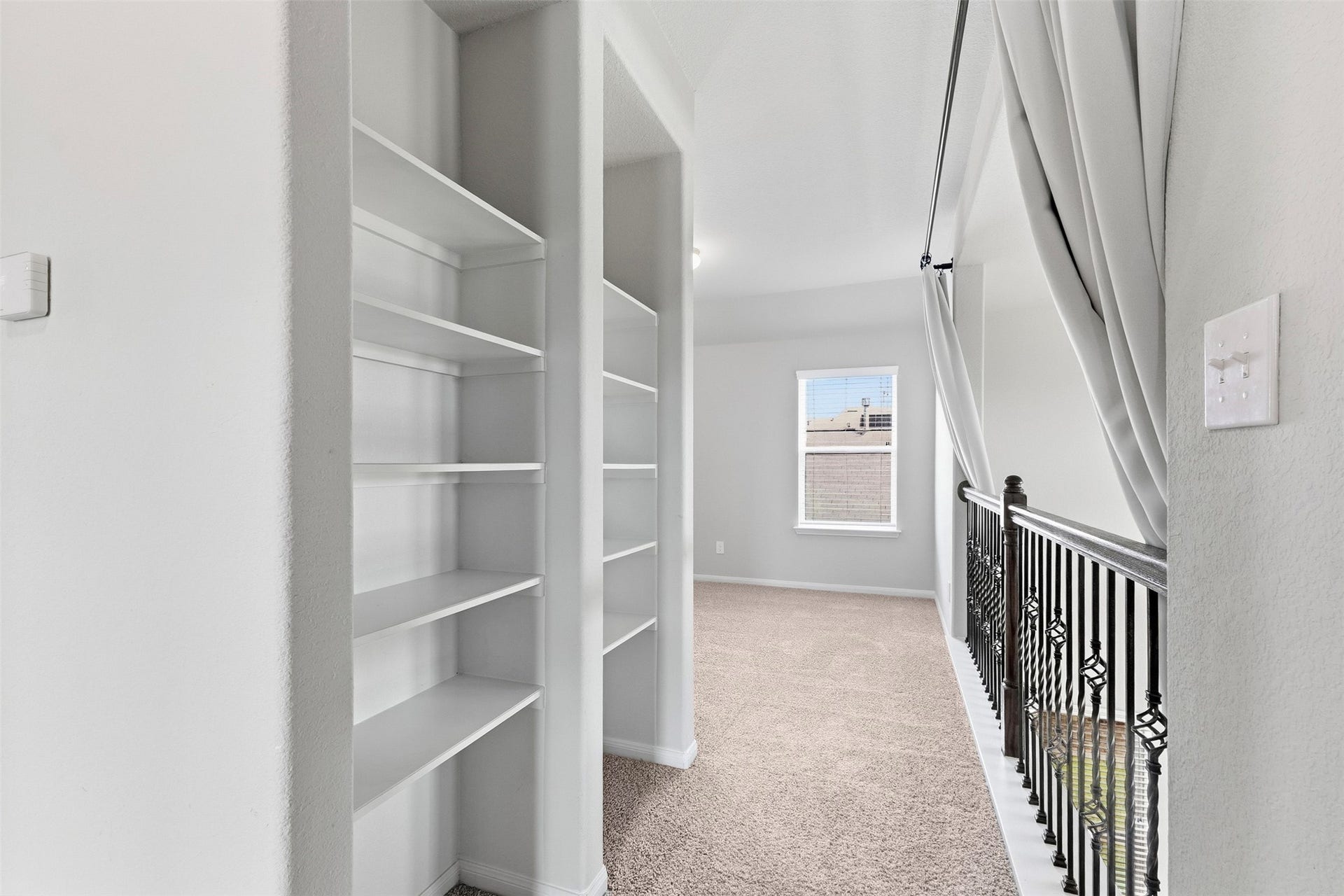 around the corner from the game room is also a little nook, perfect for storing games, books, movies and anything else you need.
