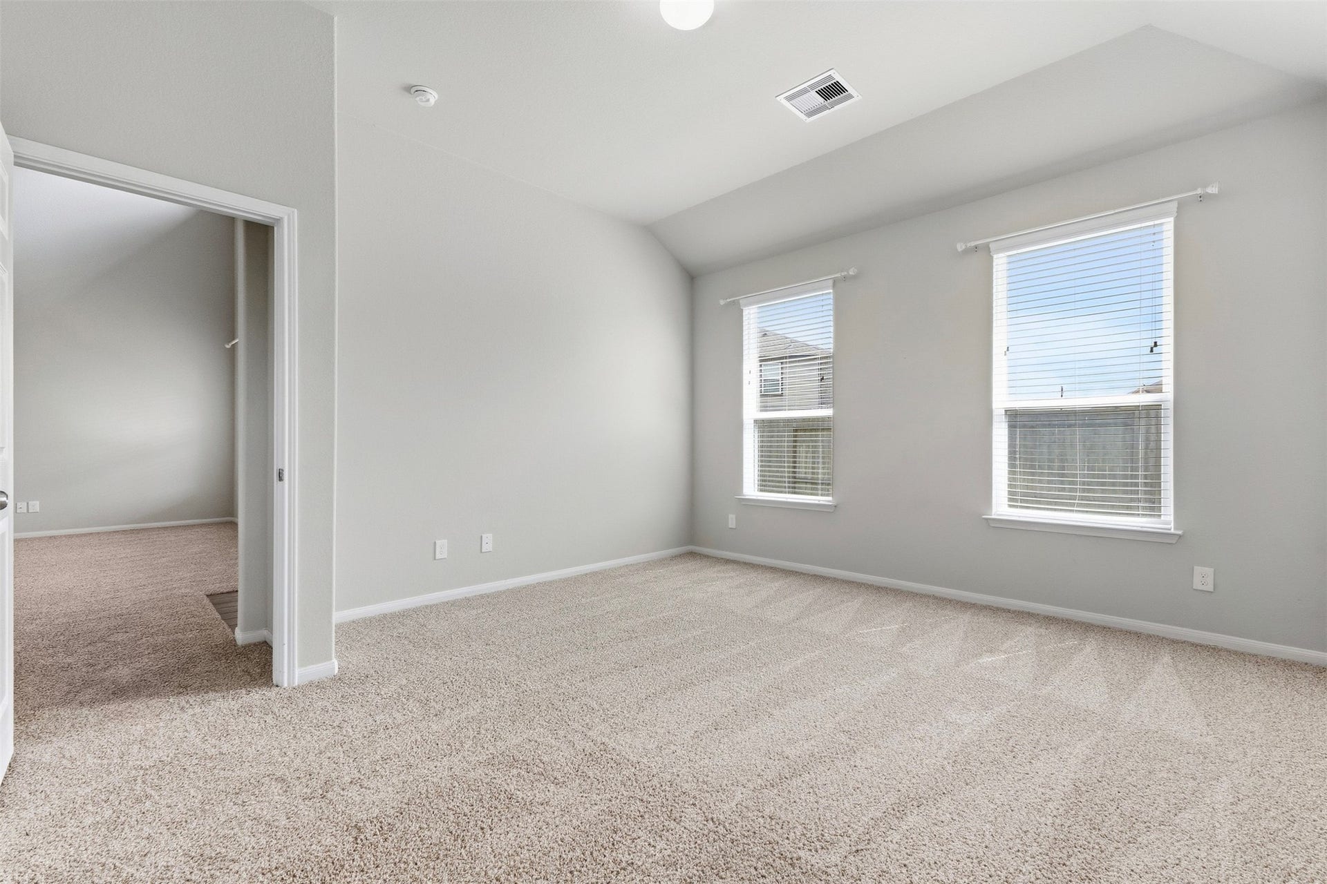 A look at the primary bedroom located downstairs off of the living room.