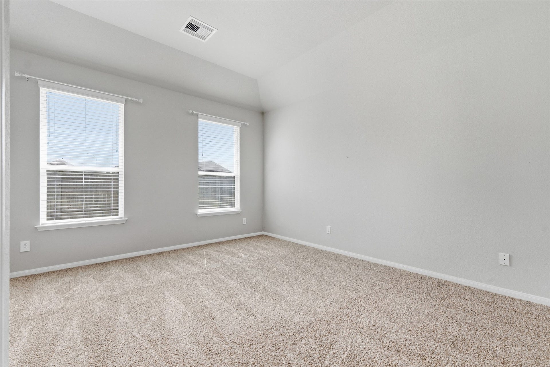 Larger furniture, no problem. This primary bedroom has plenty of space.