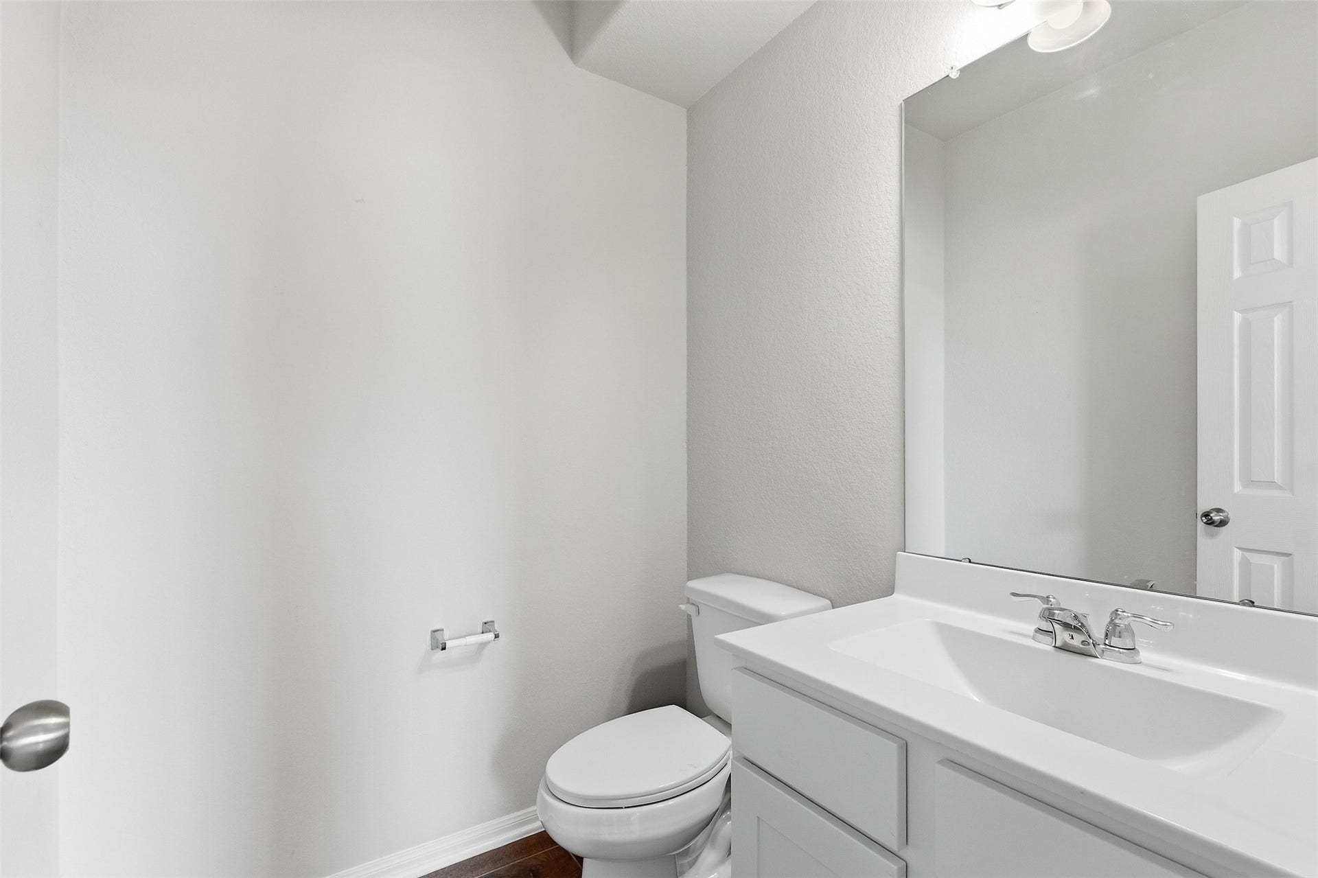 Behind the kitchen and besides the stairs is a 1/2 bathroom perfect for guests.