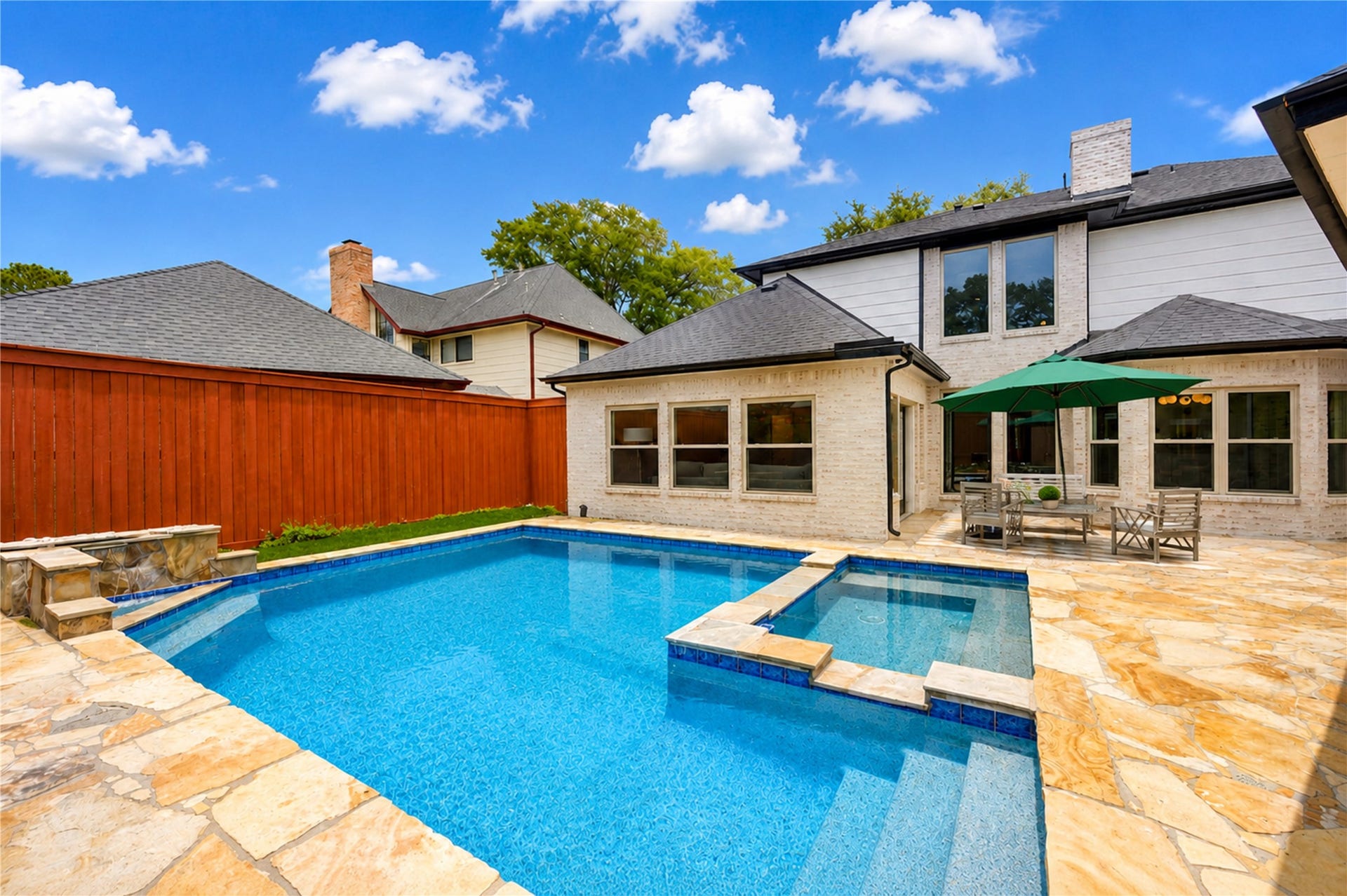 Sparkling backyard pool transforms the outdoor space into a private retreat, perfect for cooling off on warm Texas afternoons, hosting weekend gatherings or unwinding poolside as the sun sets. Expansive decking provides plenty of room for lounging, dining and enjoying relaxed outdoor living