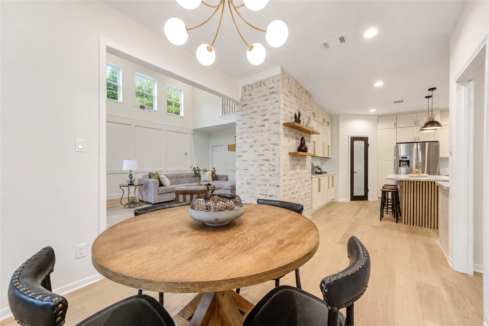 Breakfast room offers an inviting spot for casual meals, morning coffee and conversation, with an open view toward the beautifully renovated kitchen and adjoining living room. The connected layout keeps everyone together and creates an easy flow for everyday living and entertaining.
