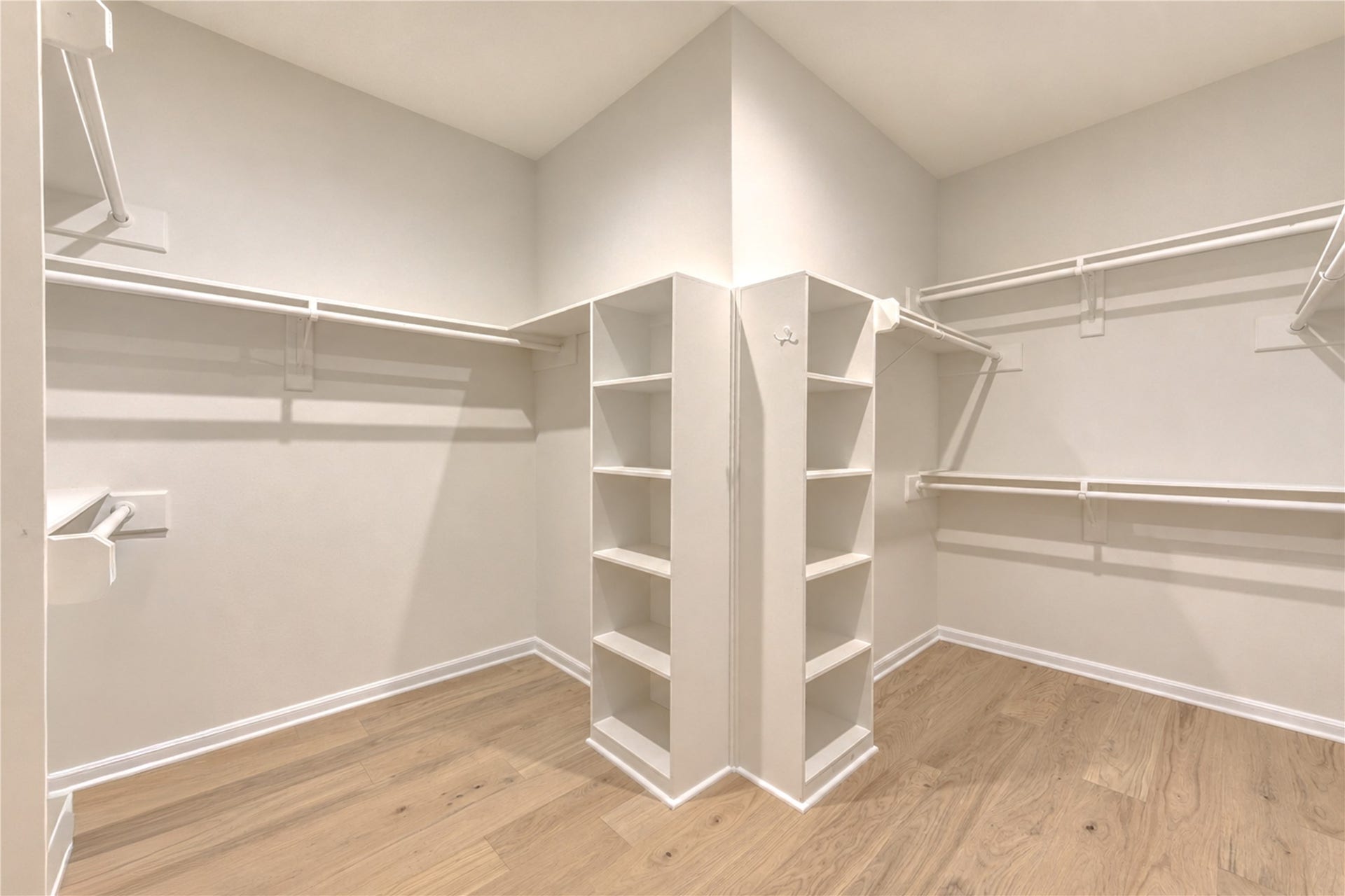 Spacious walk-in primary closet offers abundant room to keep clothing, shoes and accessories beautifully organized, making busy mornings and getting ready for an evening out feel effortless. Generous storage adds everyday convenience while completing the comfort and functionality of the private first-floor primary retreat.