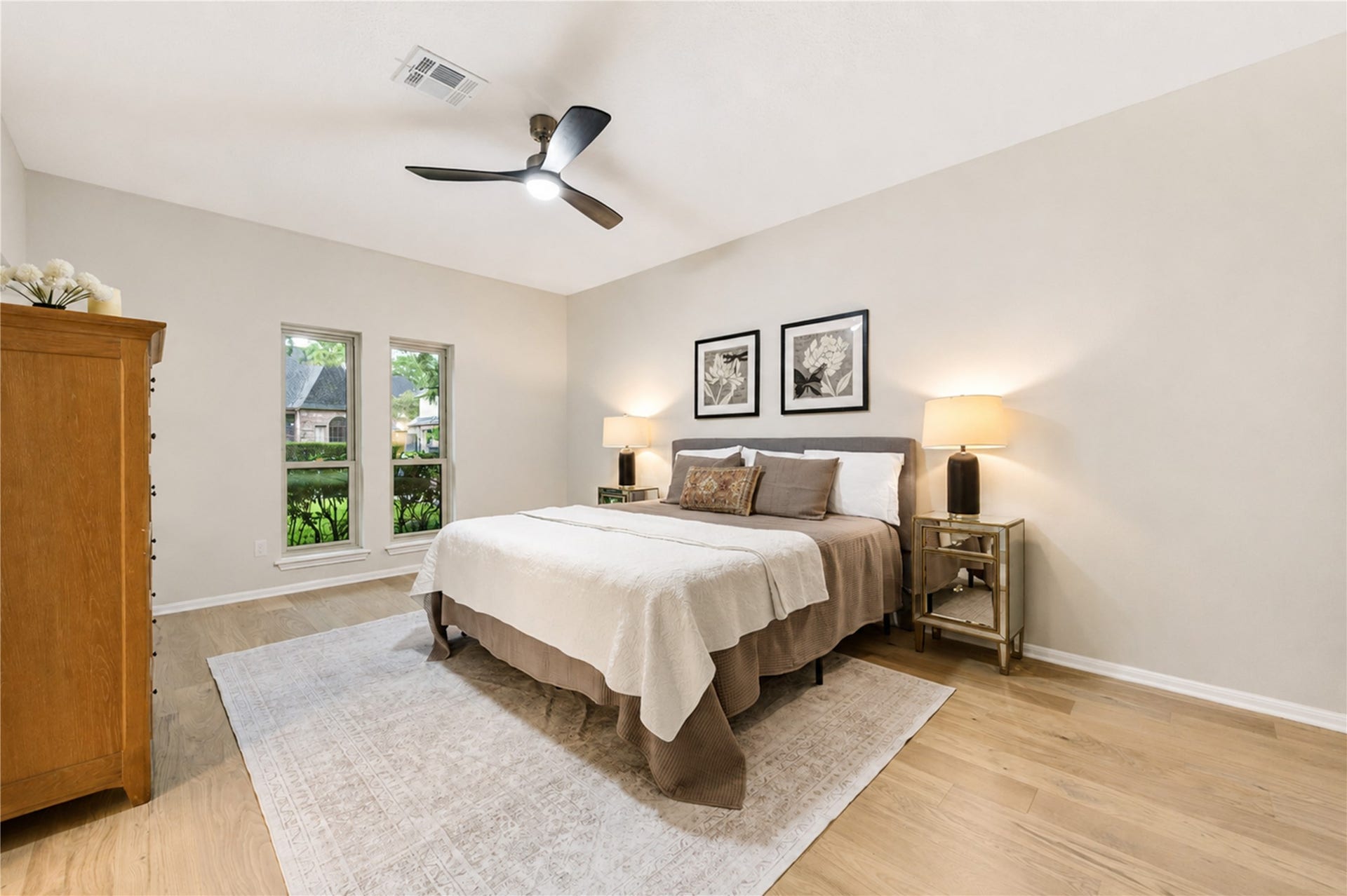 First-floor primary suite offers a peaceful retreat with French Oak floors, soft natural light and generous proportions. Tucked away from the main living areas, its an inviting place to unwind at the end of the day with the convenience of first-floor living.