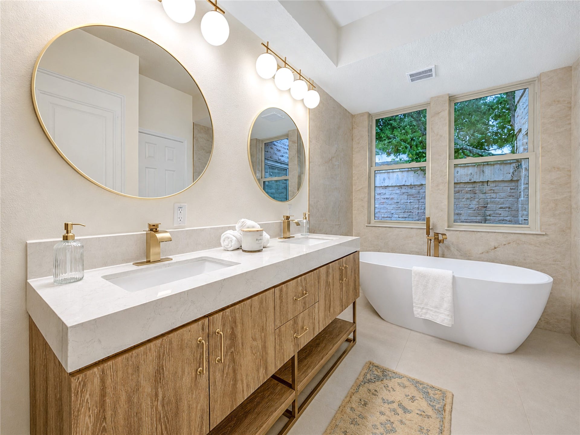 Beautifully updated primary ensuite creates a spa-like retreat with a double-sink vanity, freestanding soaking tub and abundant natural lightan inviting space to slow down, recharge and begin or end the day in comfort.