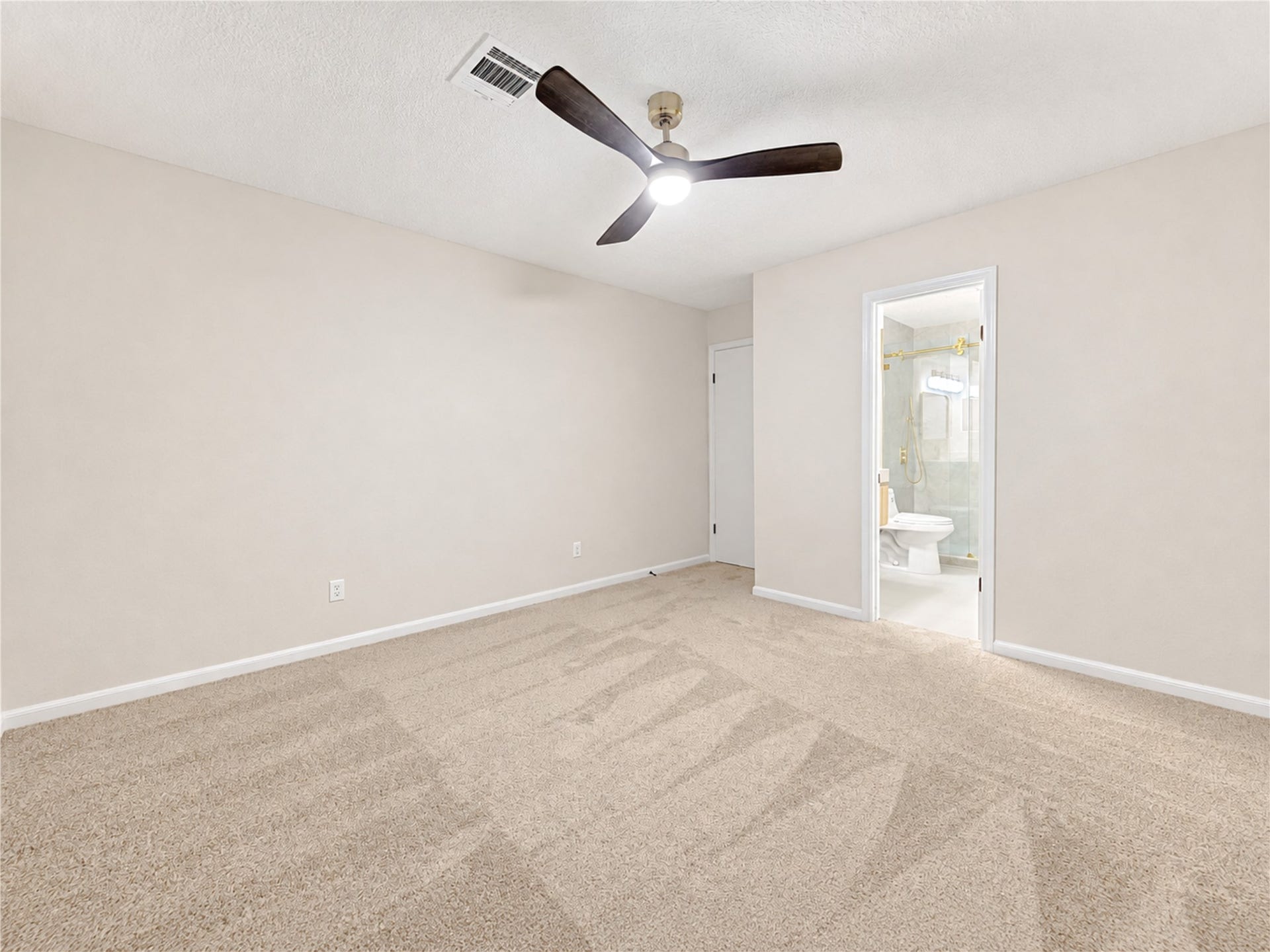 One of three upstairs bedrooms offers a comfortable private retreat with fresh paint, new carpet and the convenience of an ensuite bath. The generous space is ideal for family or guests, giving everyone a place to unwind, recharge and enjoy added privacy away from the main living areas.