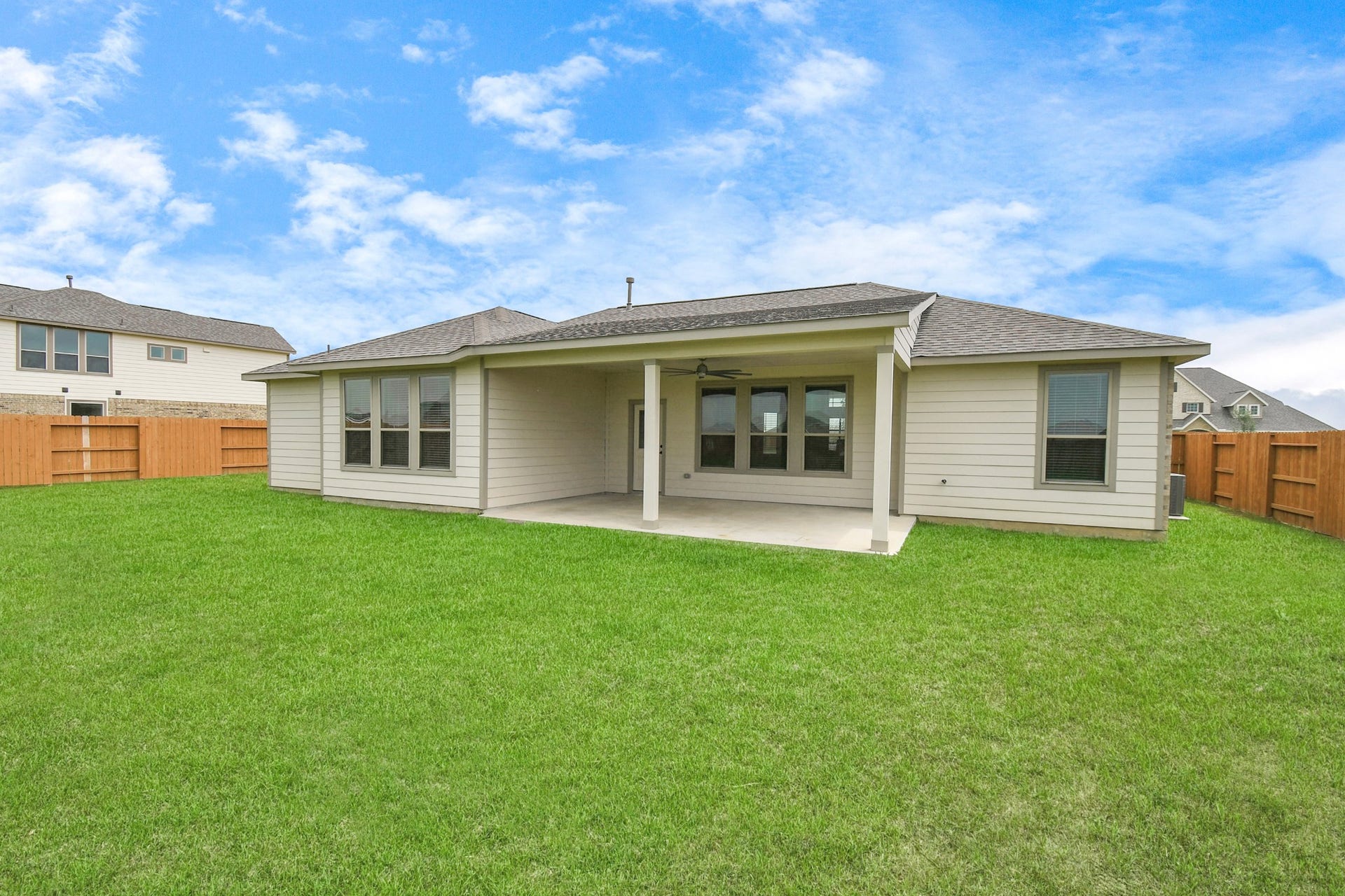 395 Hunter Ranch Way, Dayton, TX 77535 Covered rear patio overlooking the expansive backyard and approximately one half acre homesite