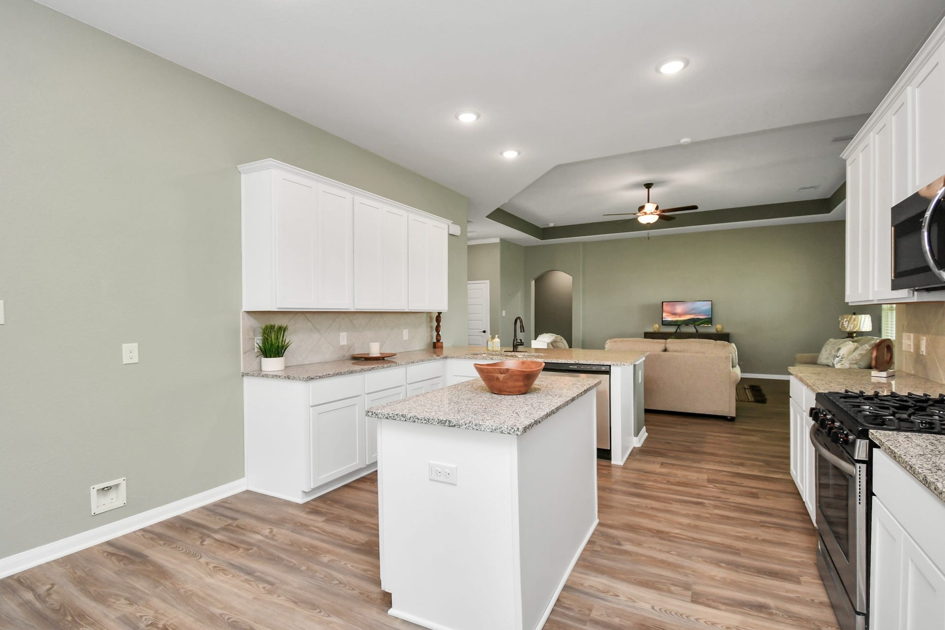 395 Hunter Ranch Way, Dayton, TX 77535 Kitchen offers ample counter space, stainless appliances and an open layout for entertaining