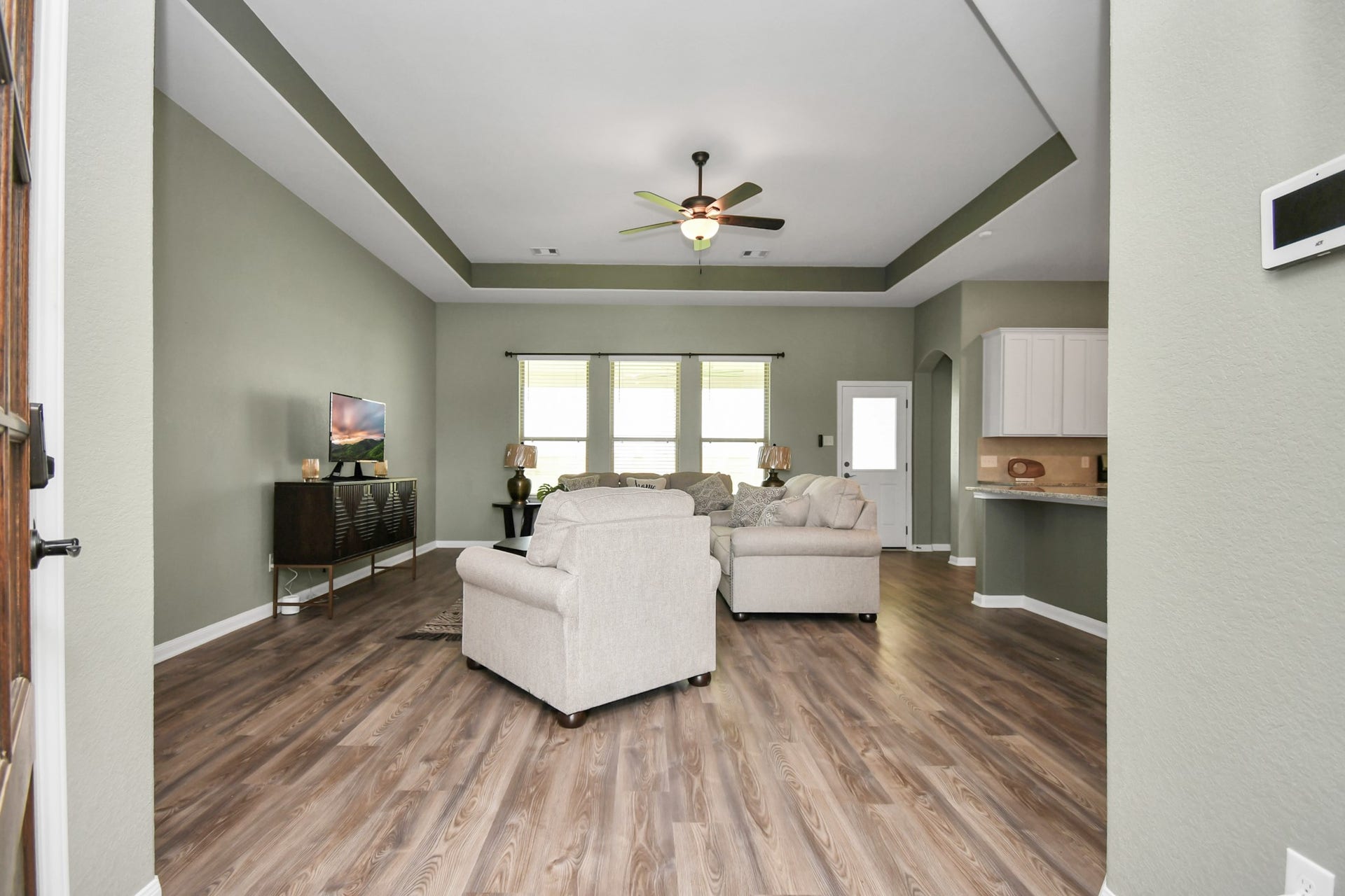 395 Hunter Ranch Way, Dayton, TX 77535 Open concept living area with high ceilings and abundant natural light