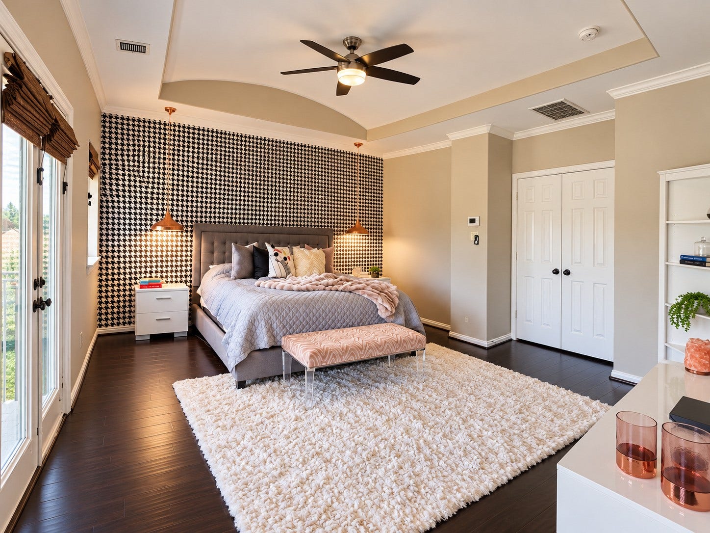 14423 Tivoli Drive, Houston, TX 77077 The spacious primary bedroom features hardwood floors, a tray ceiling, designer pendant lights and a striking accent wall.