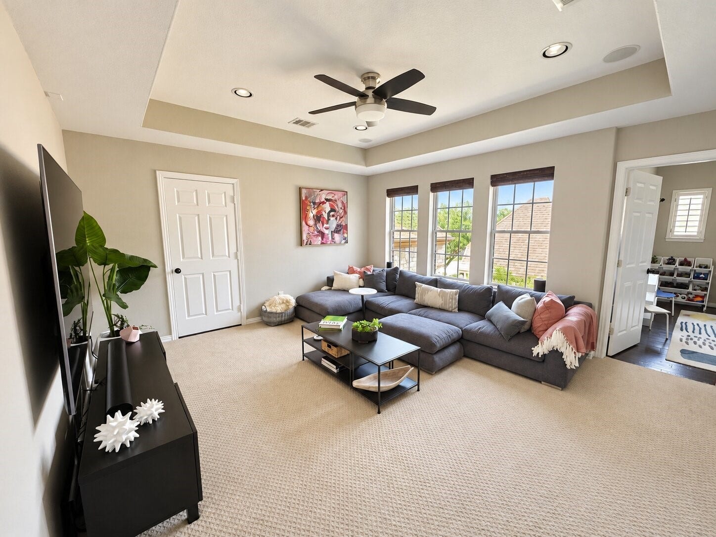14423 Tivoli Drive, Houston, TX 77077 This comfortable upstairs game/media room provides generous seating, privacy, ample natural light and convenient access to the adjoining room (currently used as a playroom).