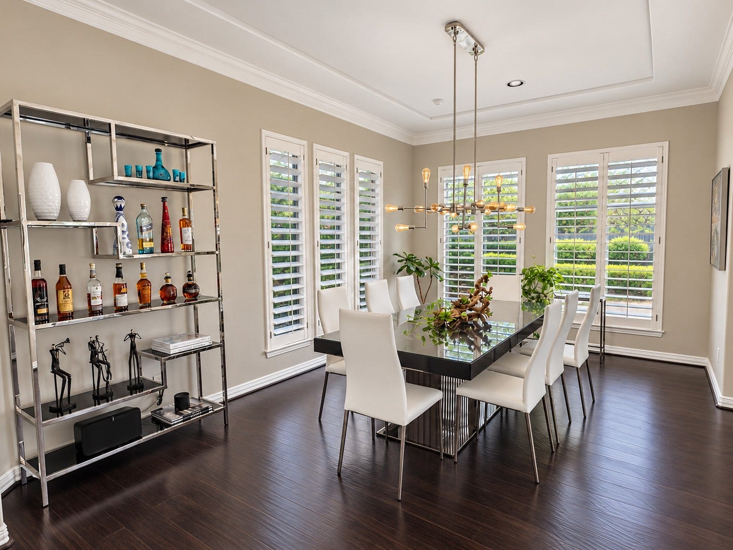 14423 Tivoli Drive, Houston, TX 77077 The formal dining room combines a modern chandelier, plantation shutters and generous space for gatherings.