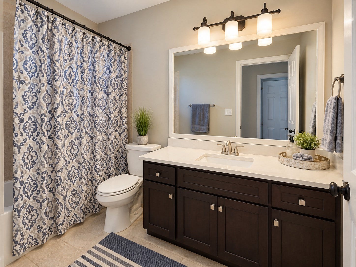 14423 Tivoli Drive, Houston, TX 77077 This secondary bathroom offers a full tub and shower combination and vanity storage.