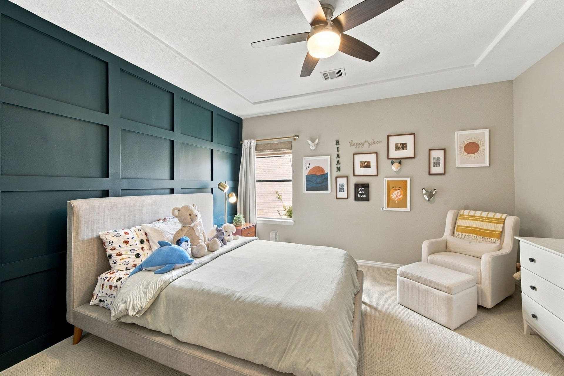 14423 Tivoli Drive, Houston, TX 77077 A distinctive paneled accent wall gives this secondary bedroom plenty of character.