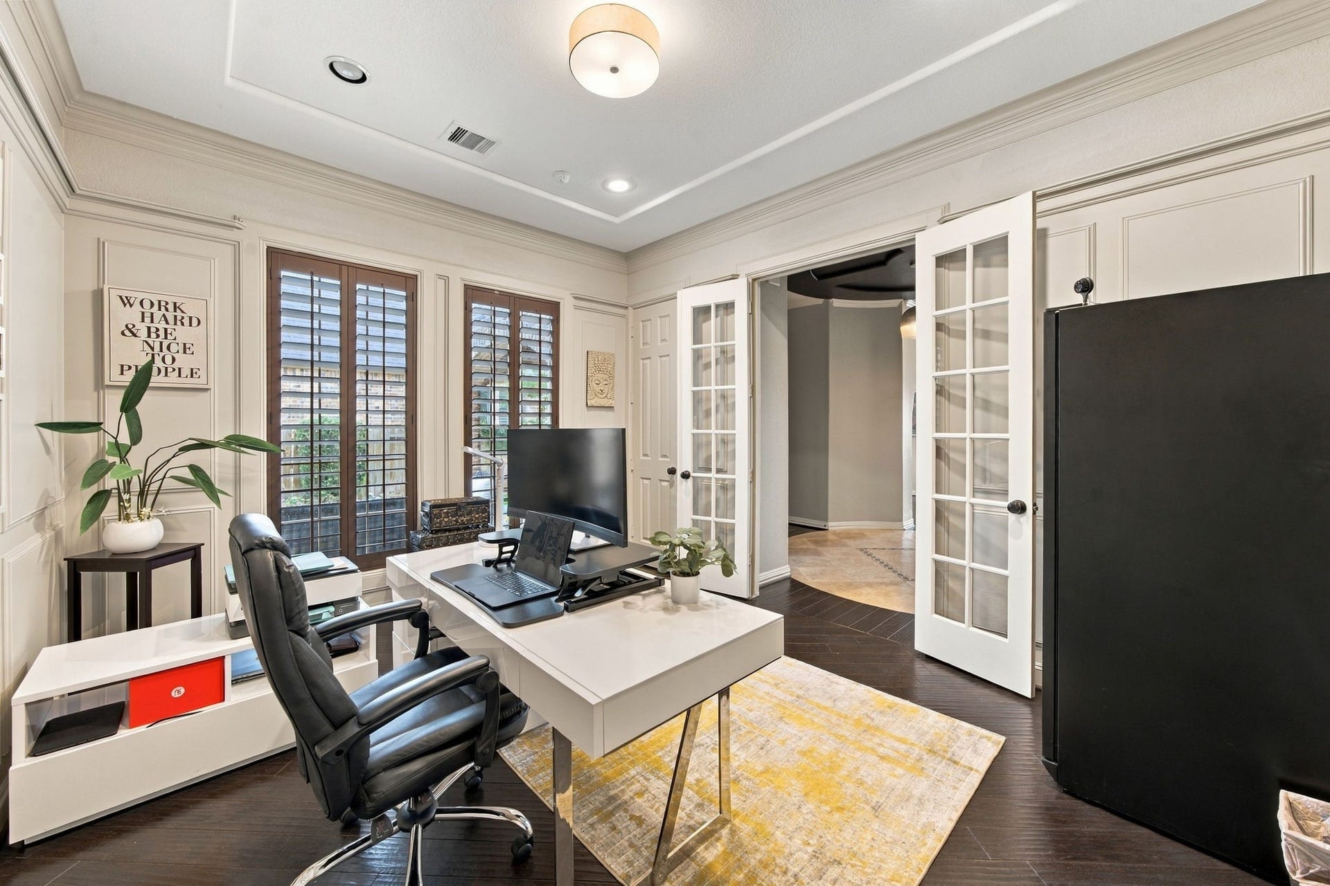 14423 Tivoli Drive, Houston, TX 77077 The private home office features elegant wall paneling, plantation shutters, hardwood floors and French doors opening to the main foyer.