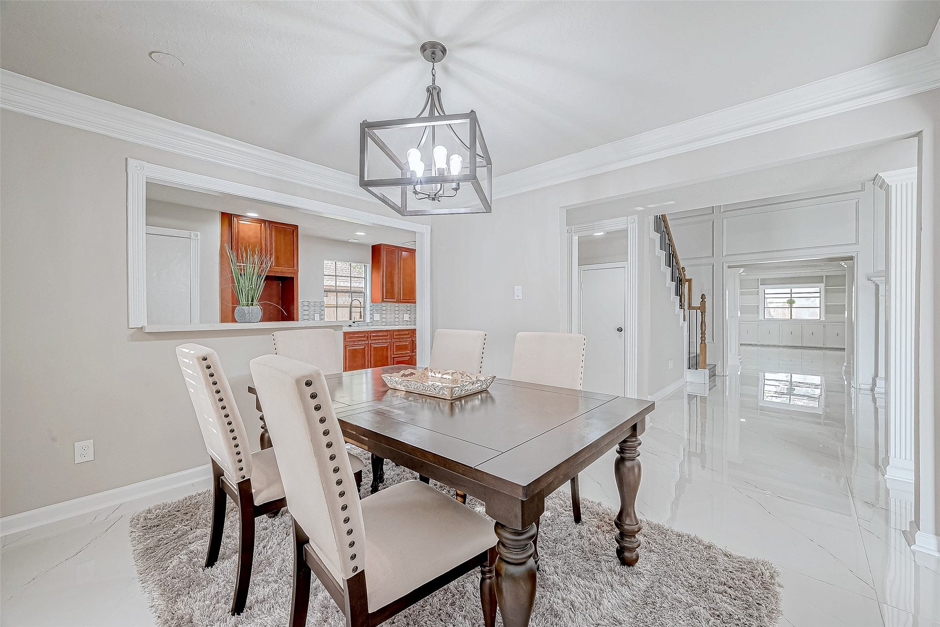 3102 Glenn Lakes Lane, Missouri City, TX 77459 Dining Room includes a wooden dining table with upholstered chairs.
